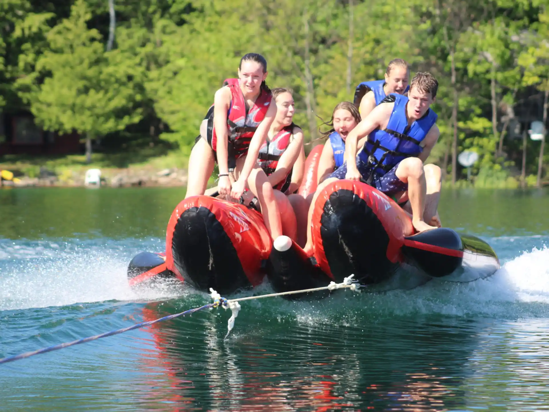 a group of people on a raft