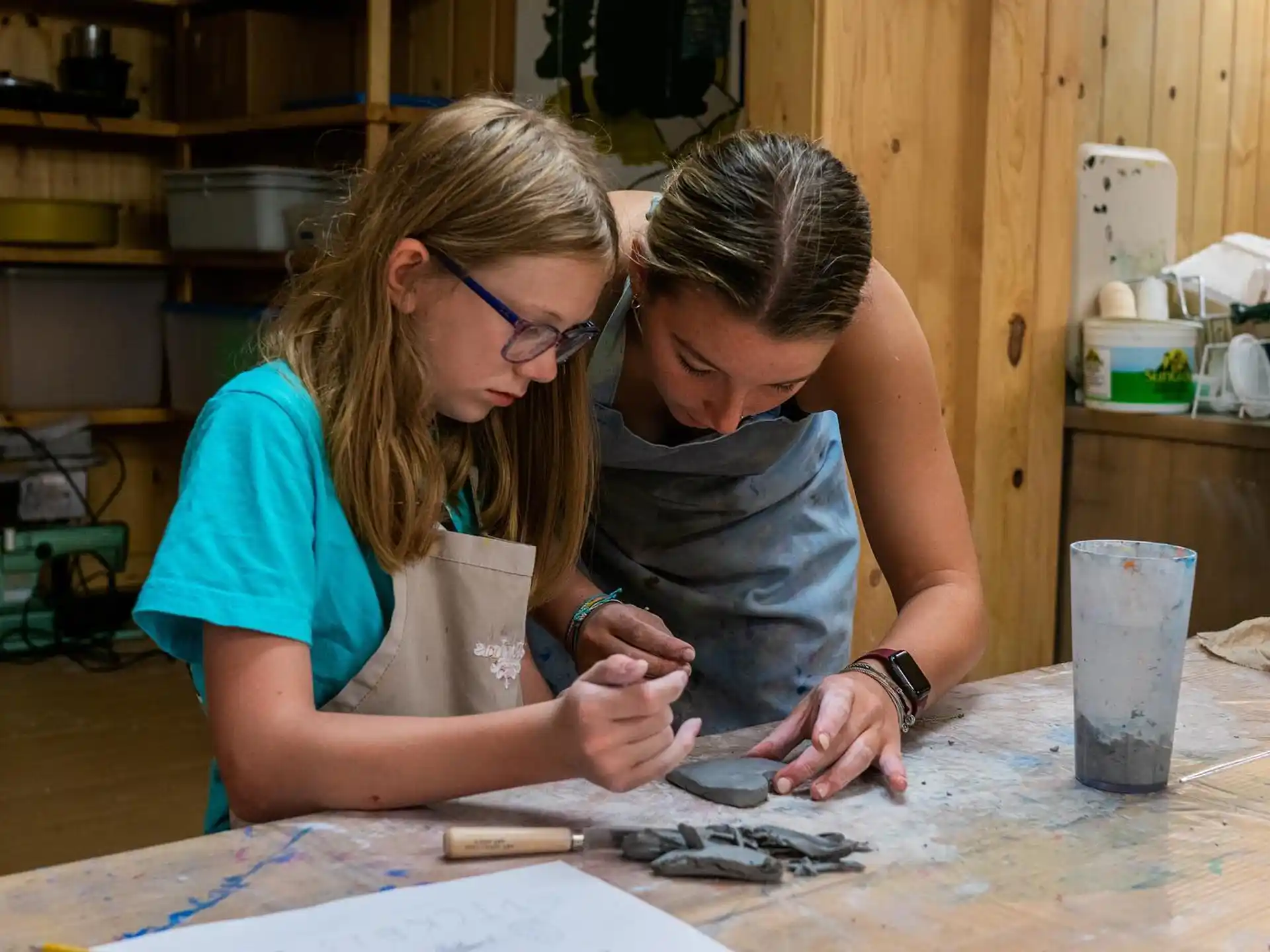 a couple of women painting