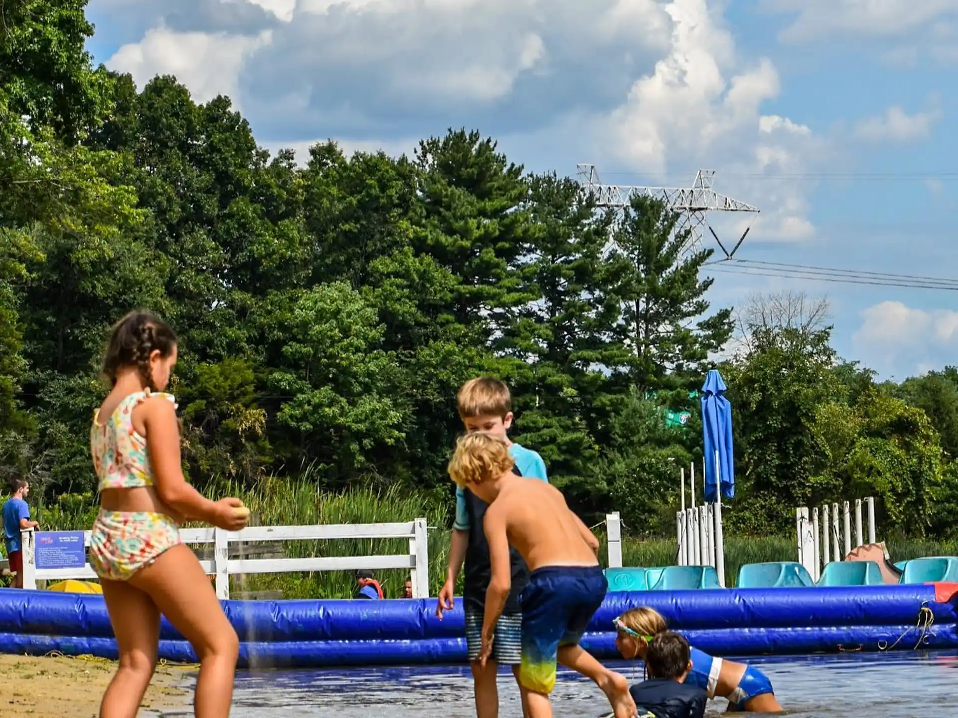 a group of people playing in a pool