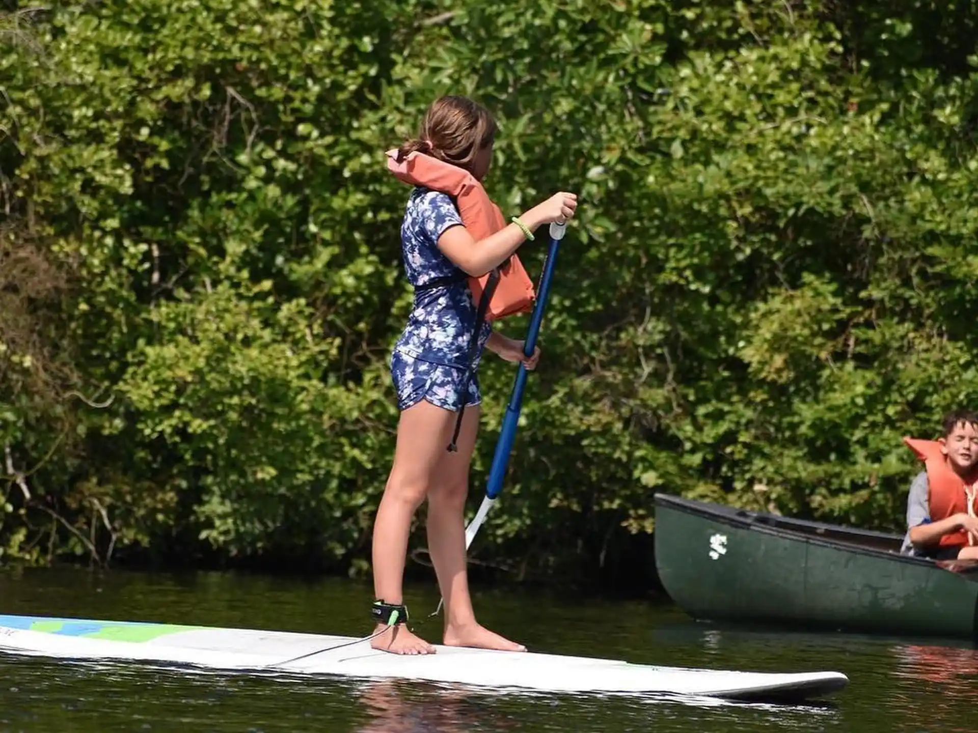 a girl on a paddle board