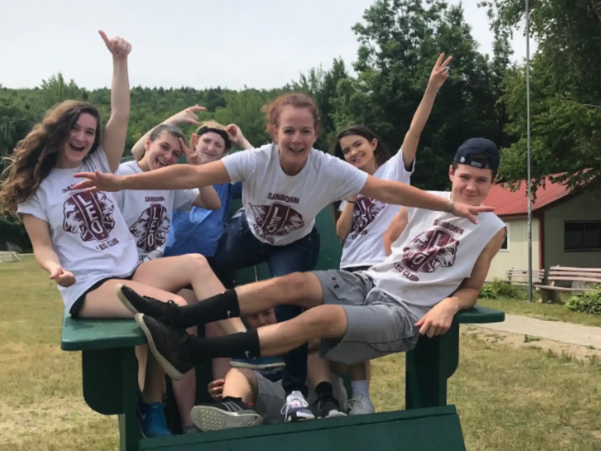 a group of people on a green slide