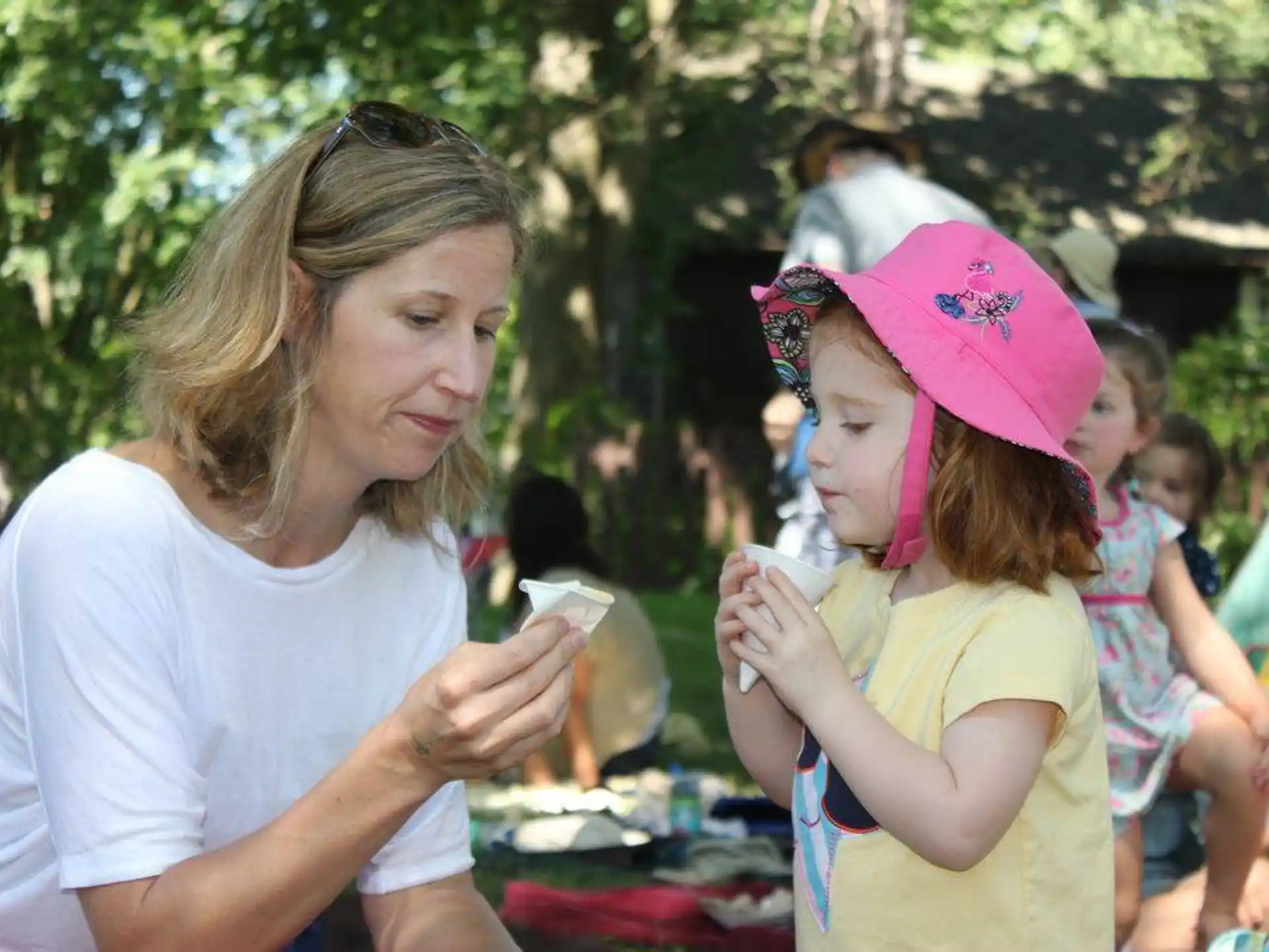 a person and a girl at an outdoor event