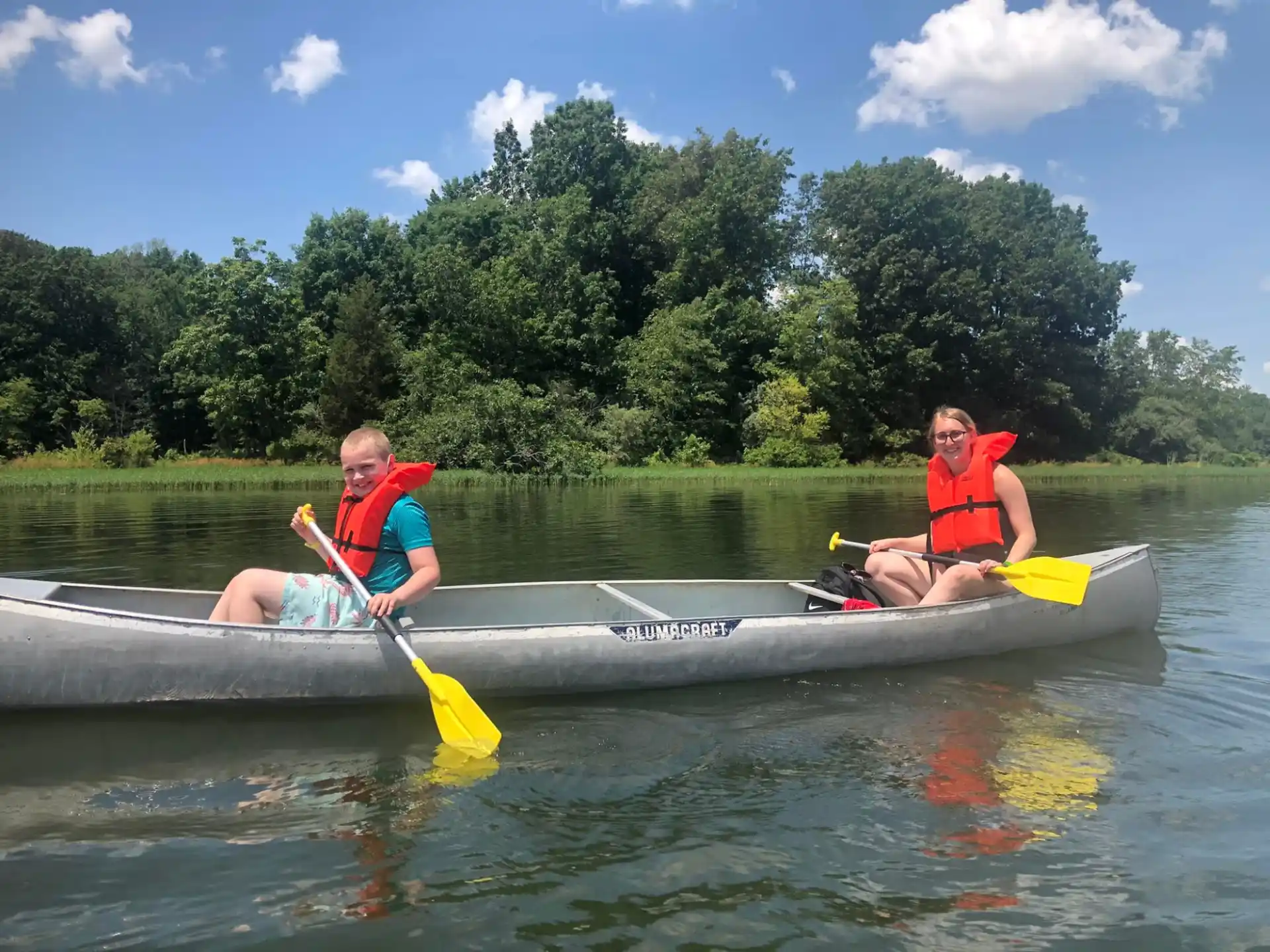 a couple of people in a canoe
