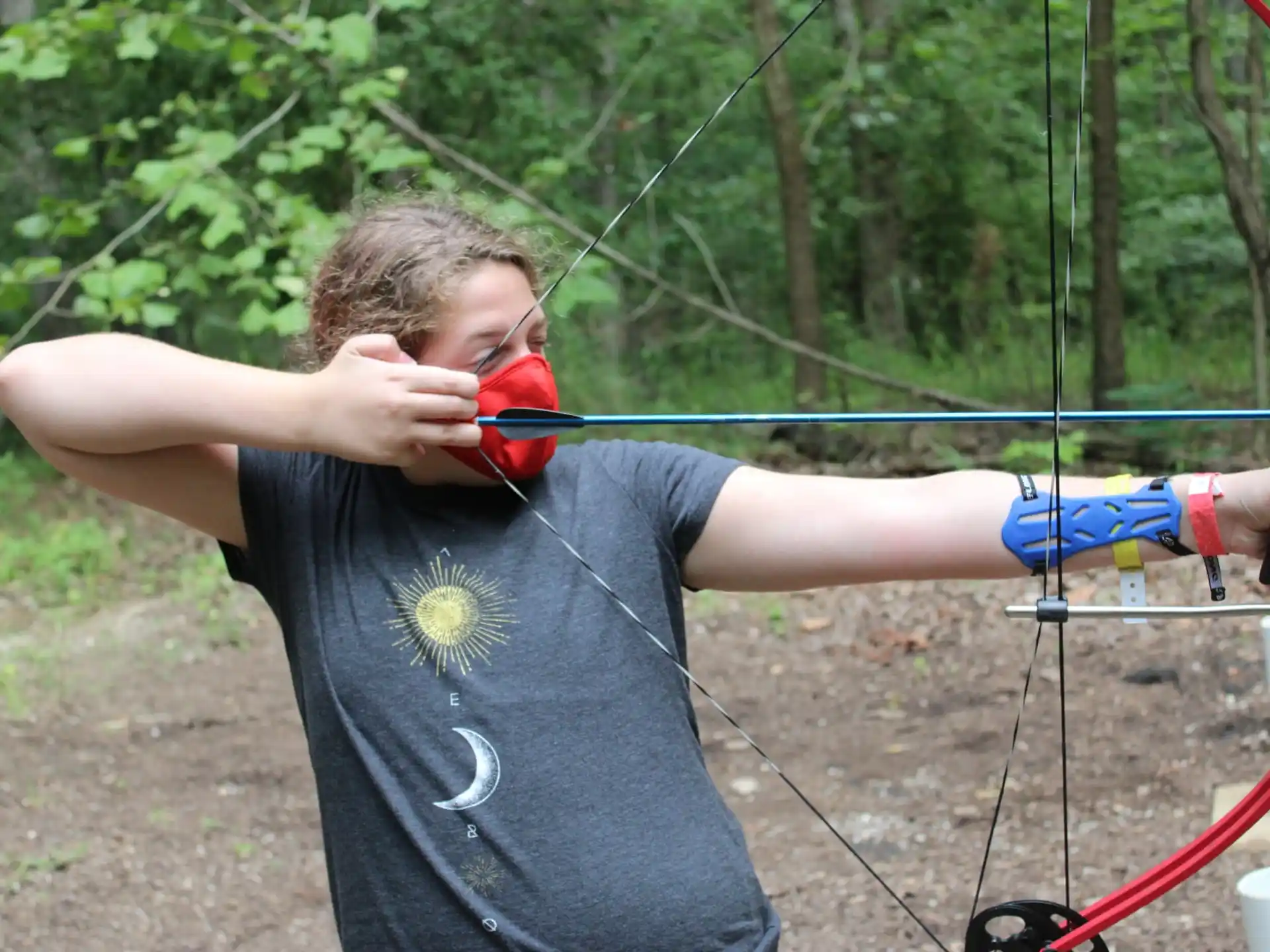 a person holding a bow and arrow