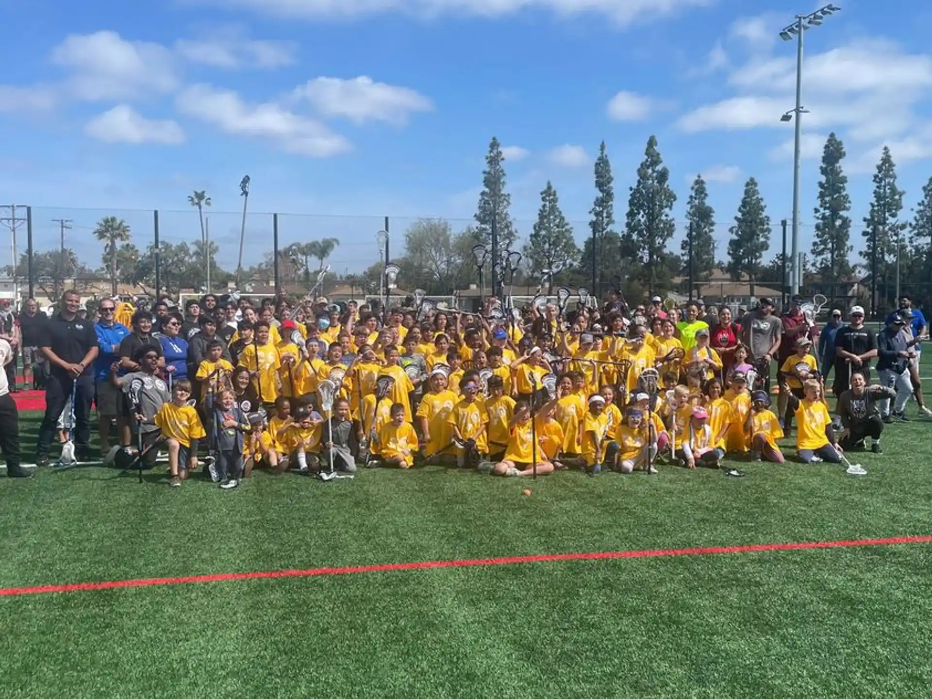 a group of people in yellow uniforms on a field