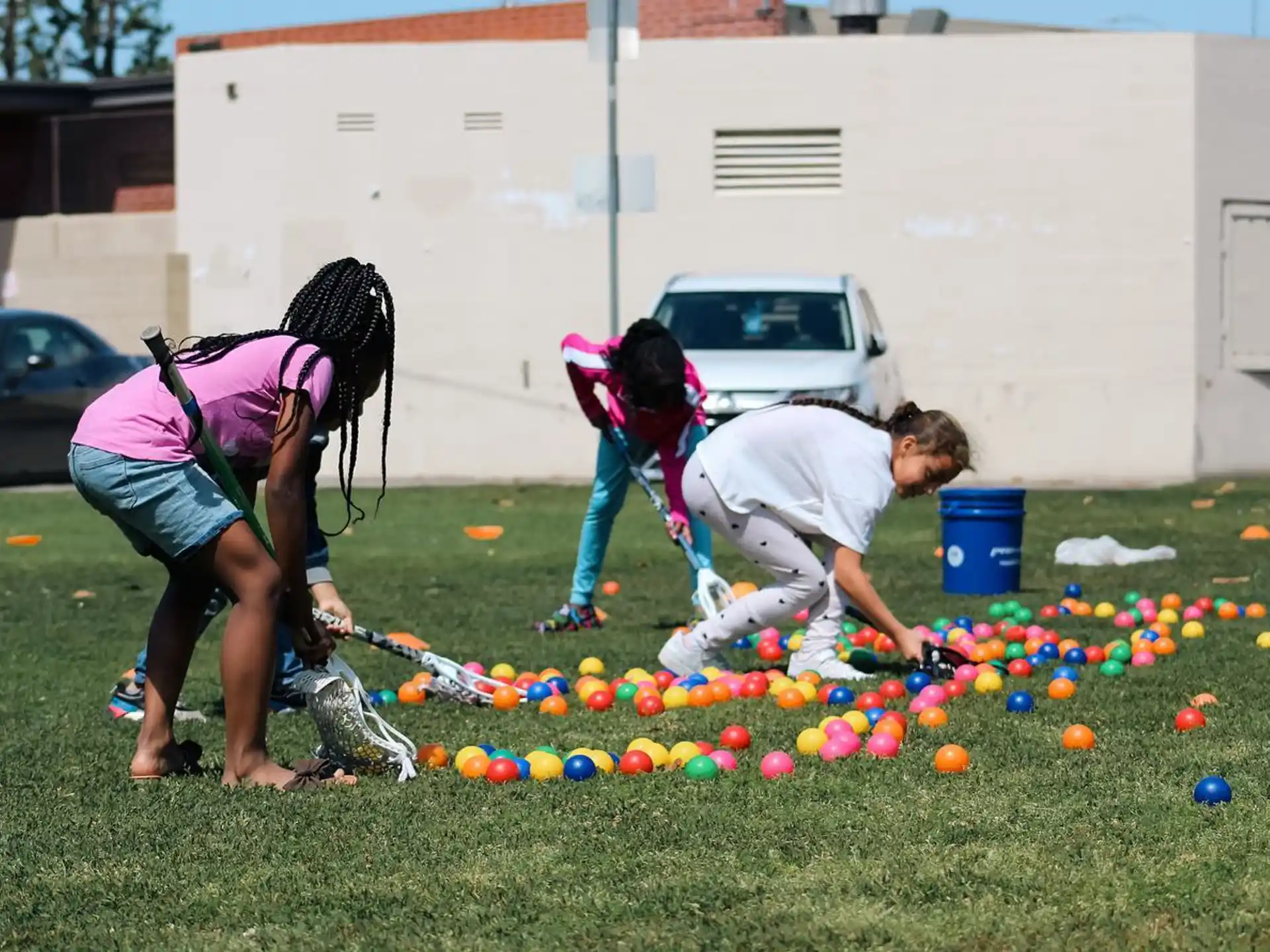 a group of people playing with balls