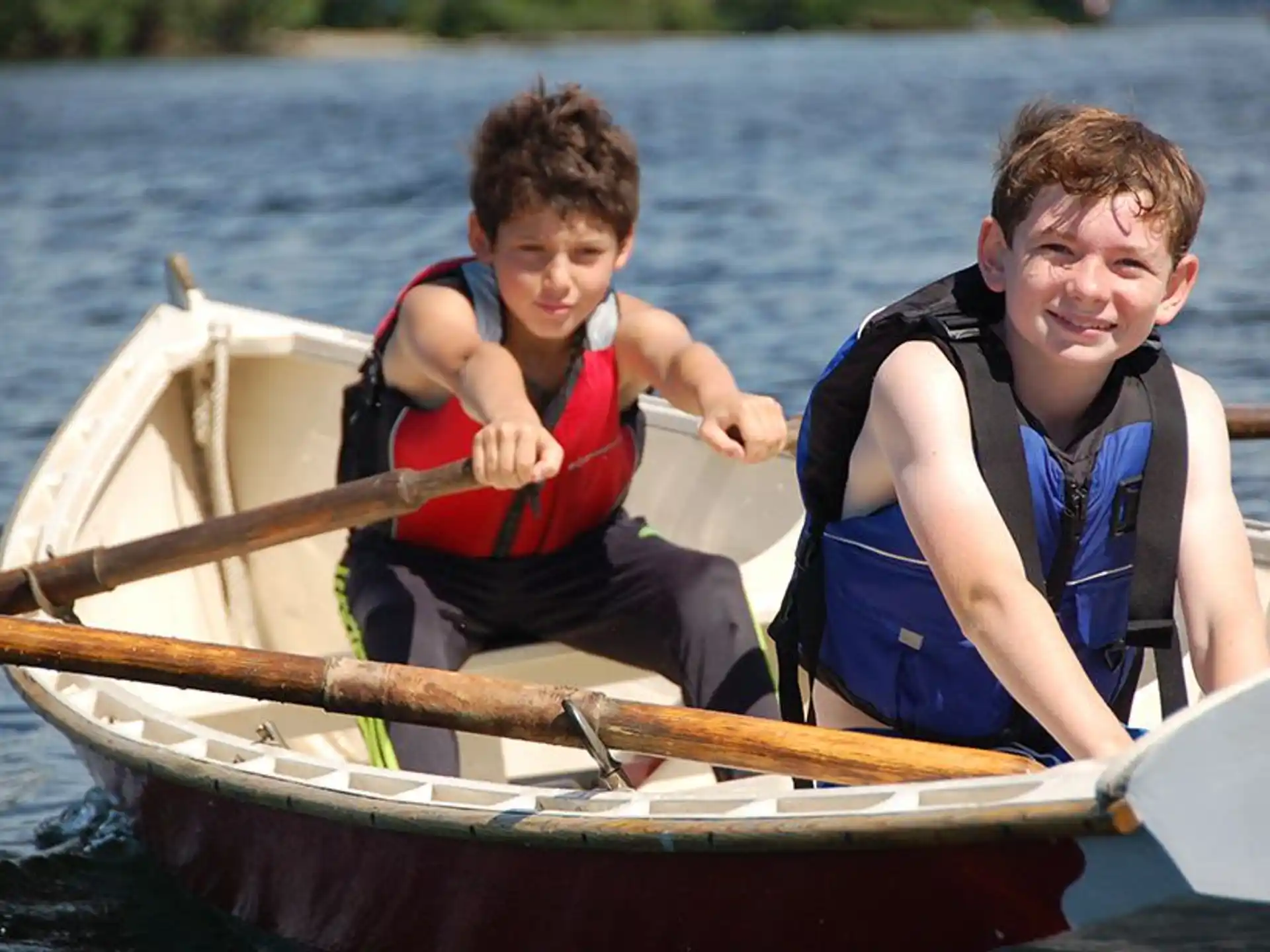 a couple of boys in a canoe
