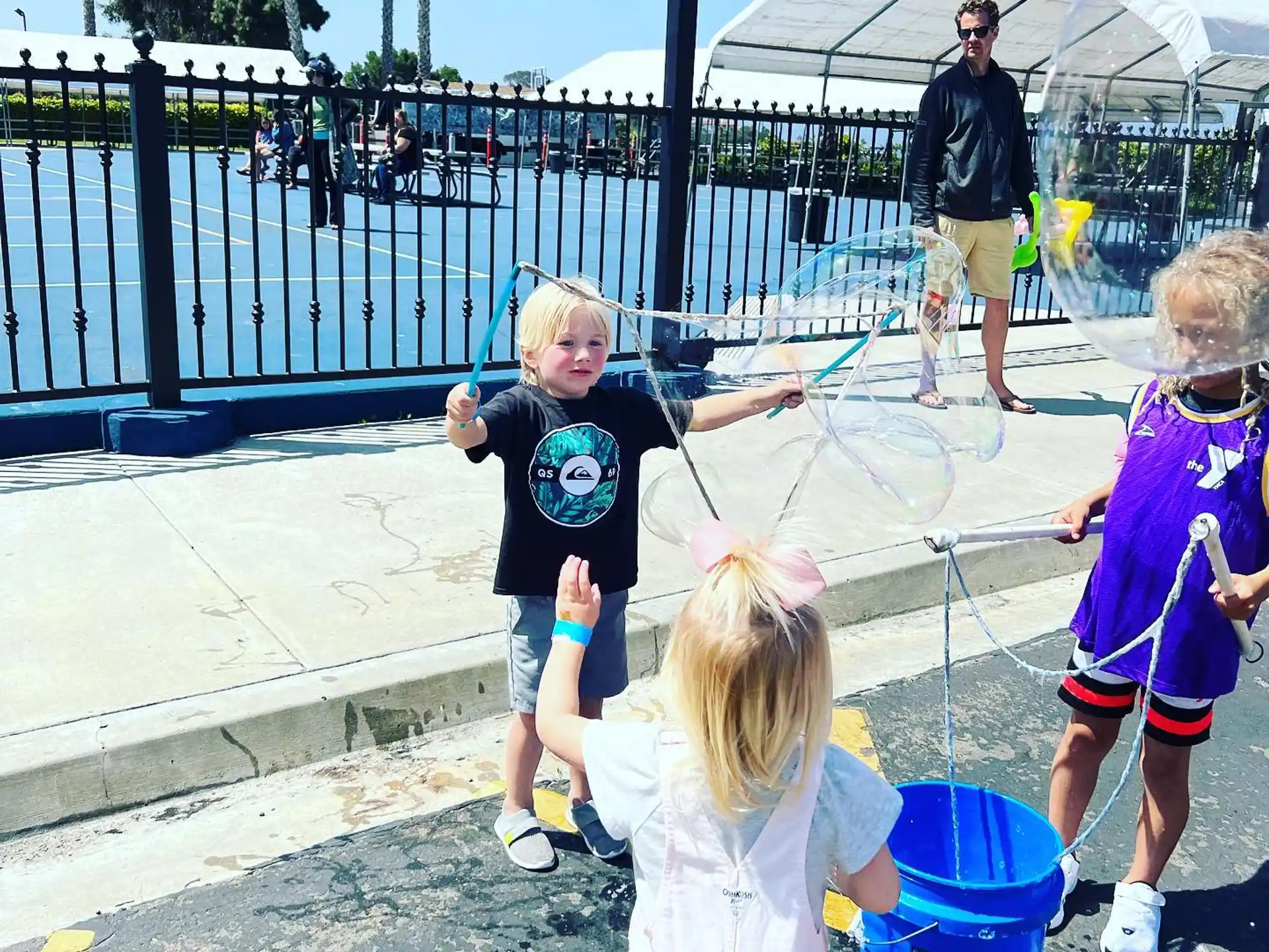 a group of kids playing in a playground