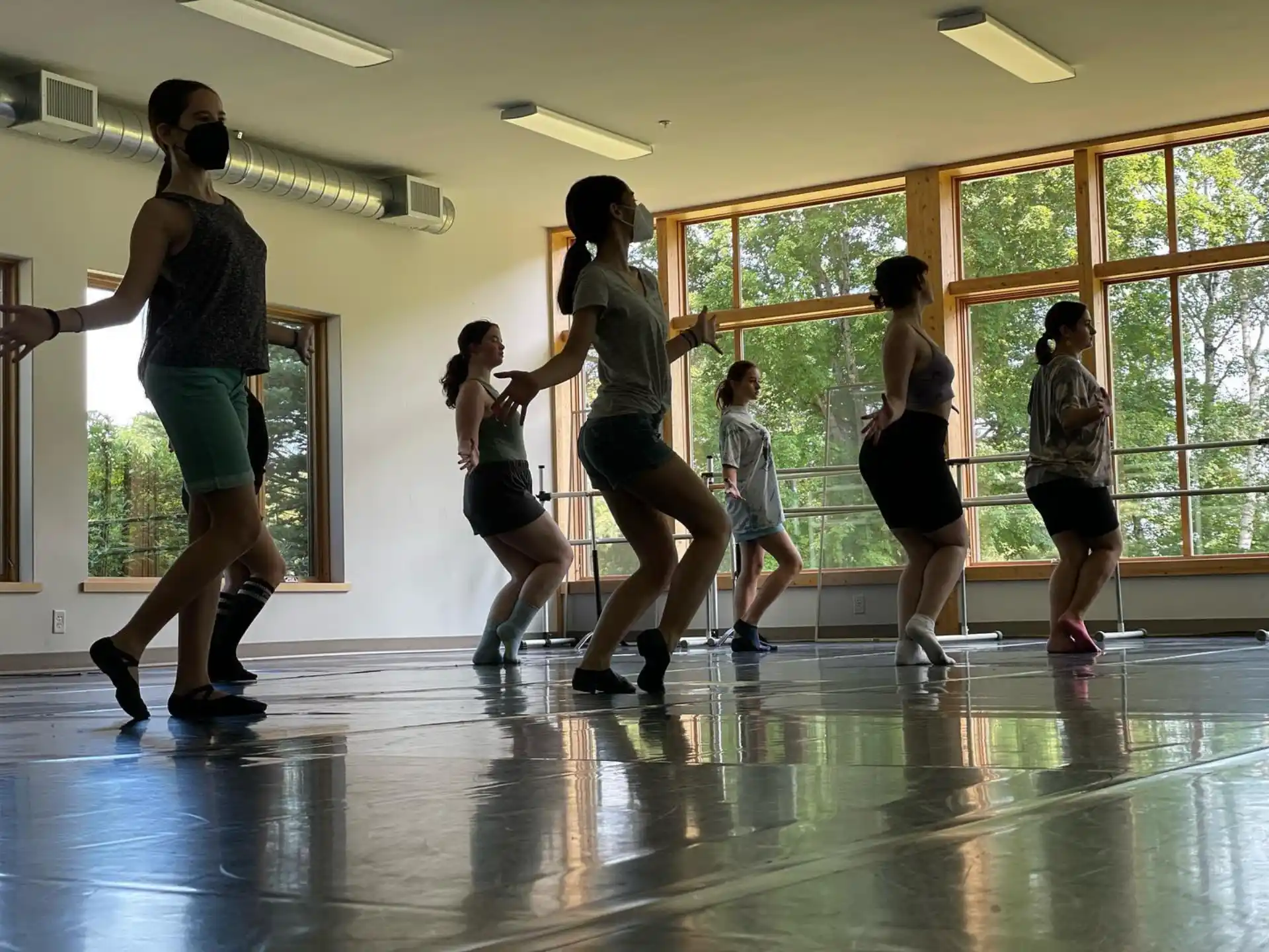 a group of people dancing in a room