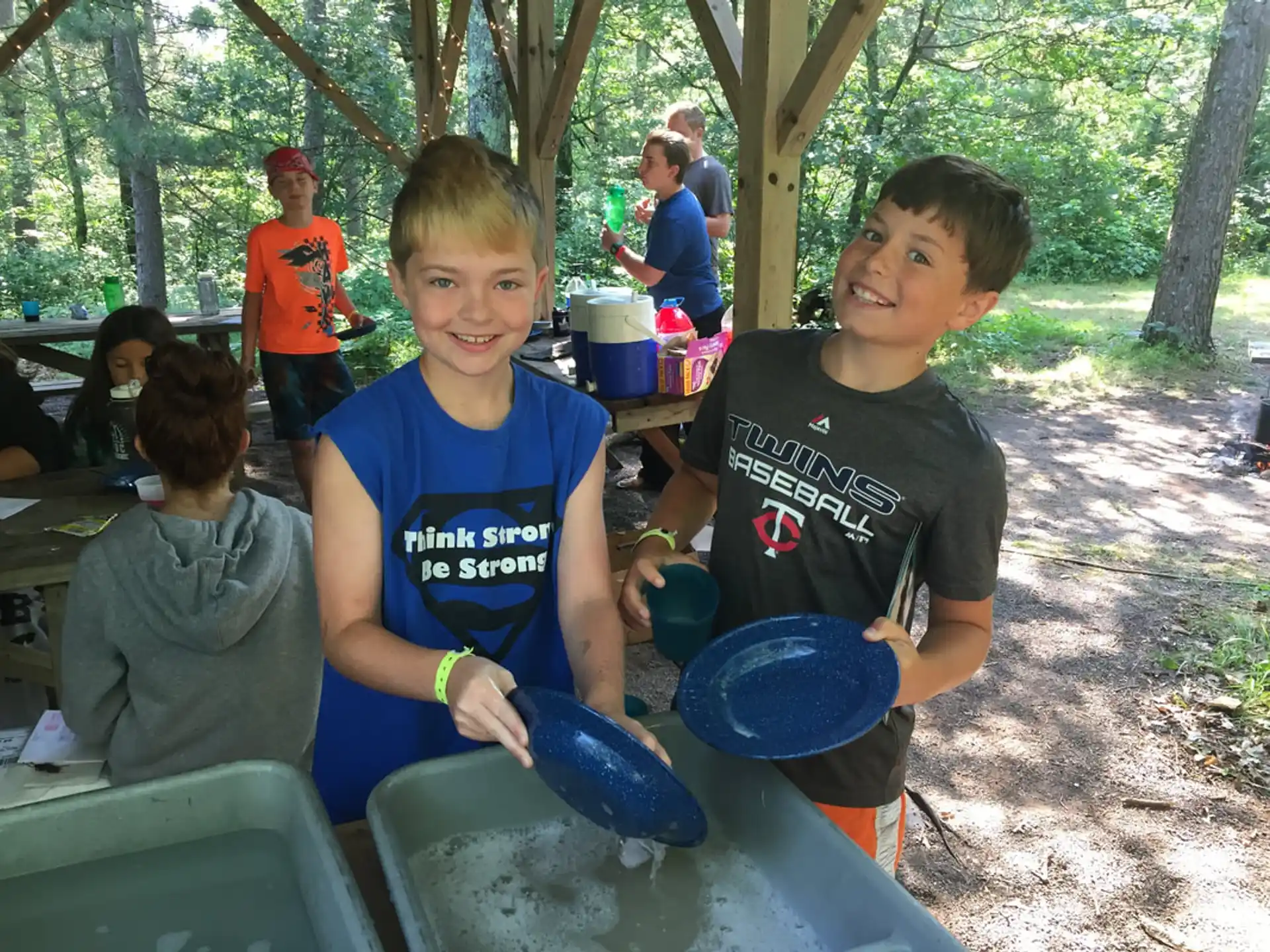 a group of kids holding frisbees