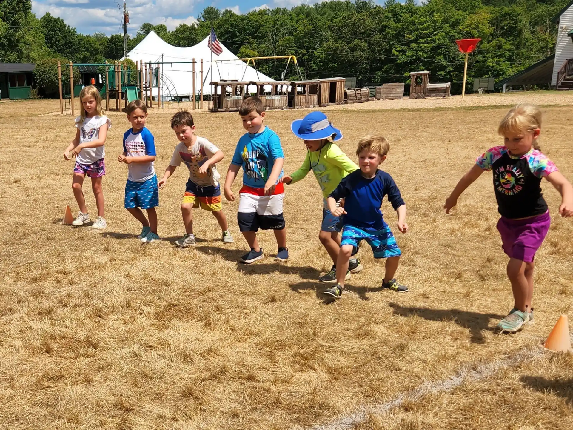 a group of kids playing in a field