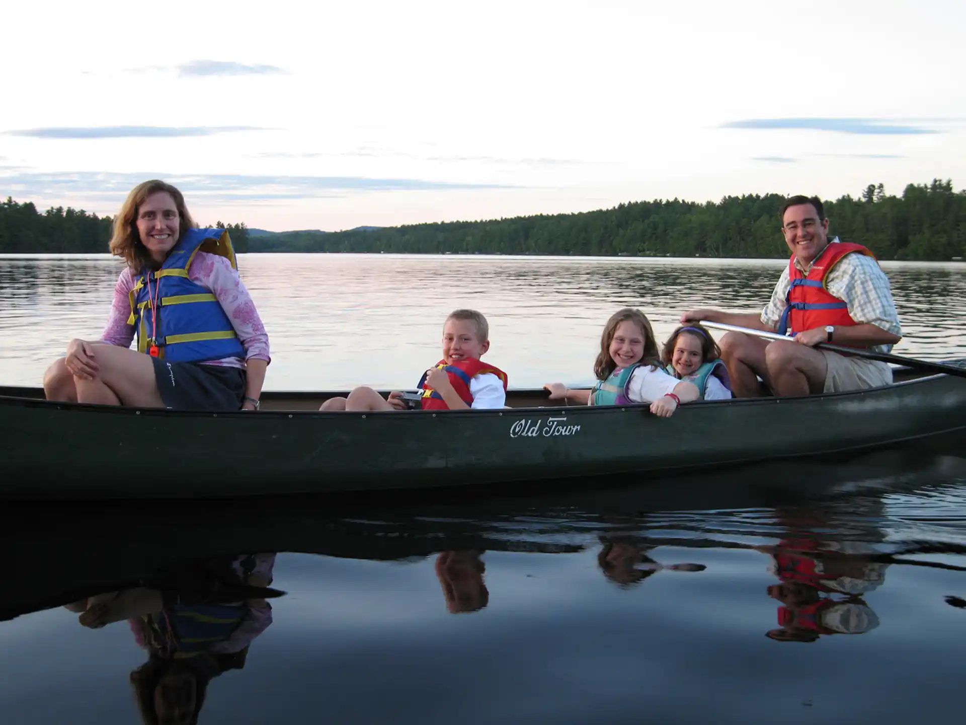 a group of people in a canoe
