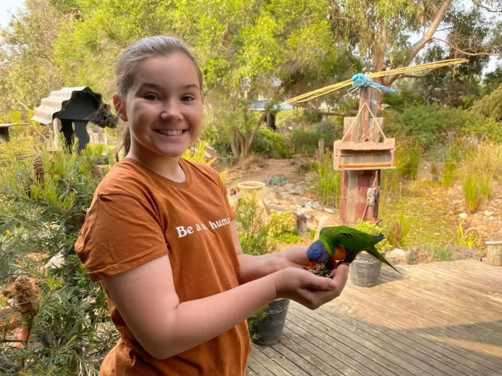 a girl holding a toy