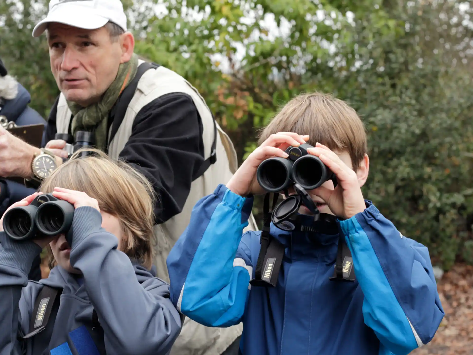 a group of people holding cameras