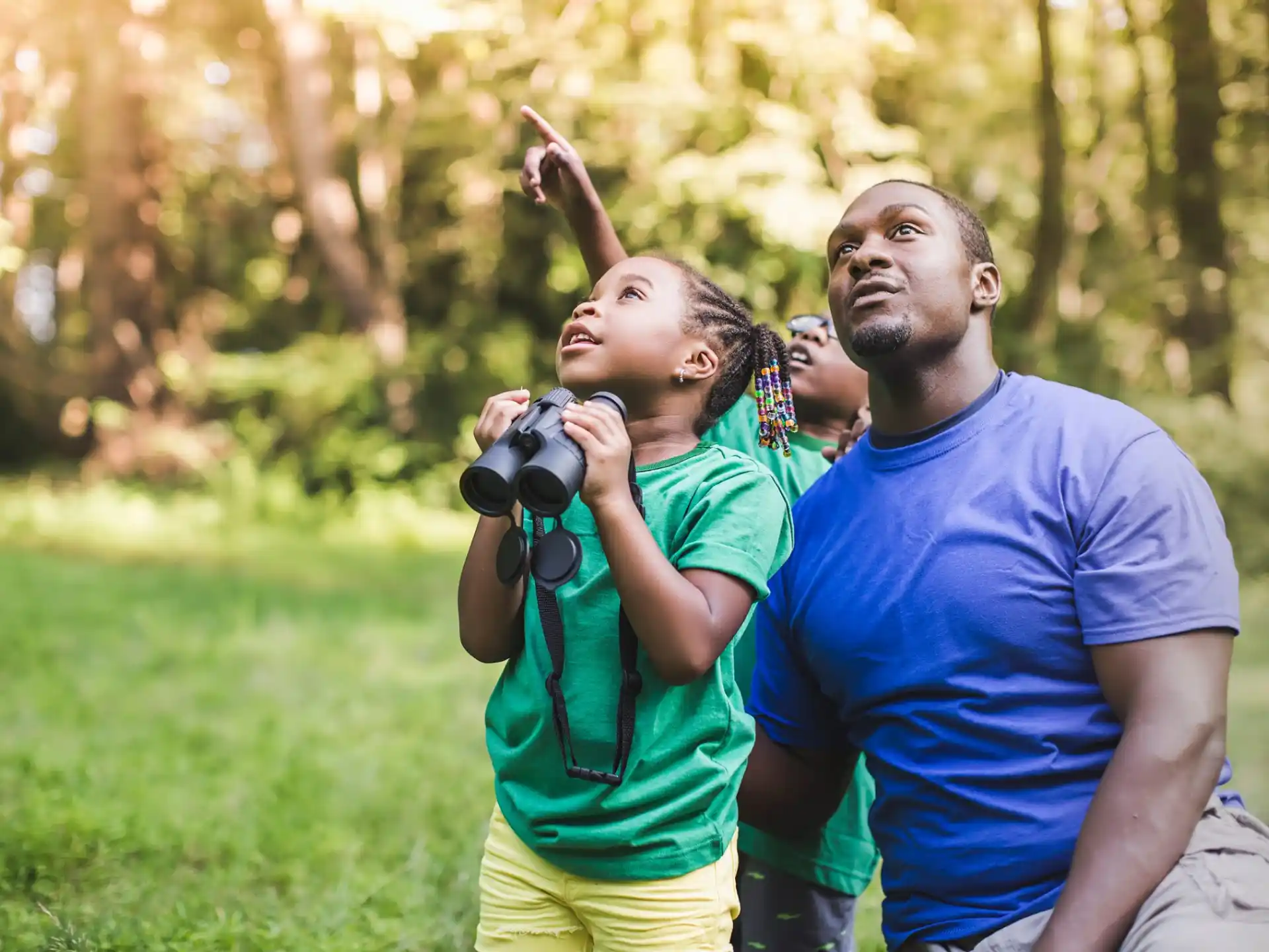 a man and a woman taking a picture in a park