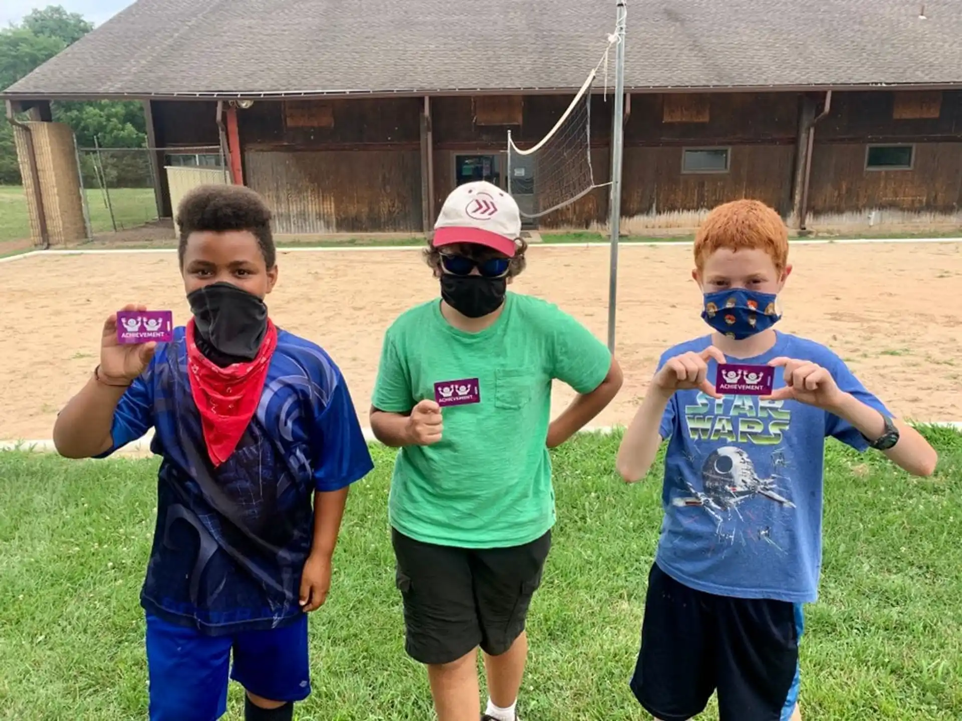 a group of boys wearing masks