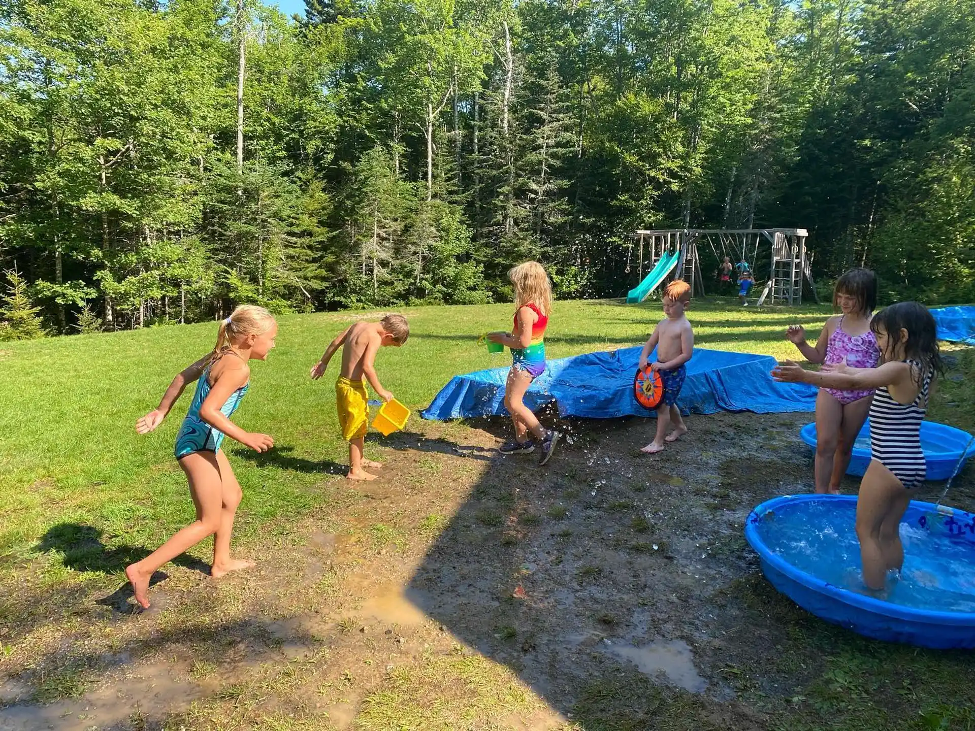 a group of children playing in a playground
