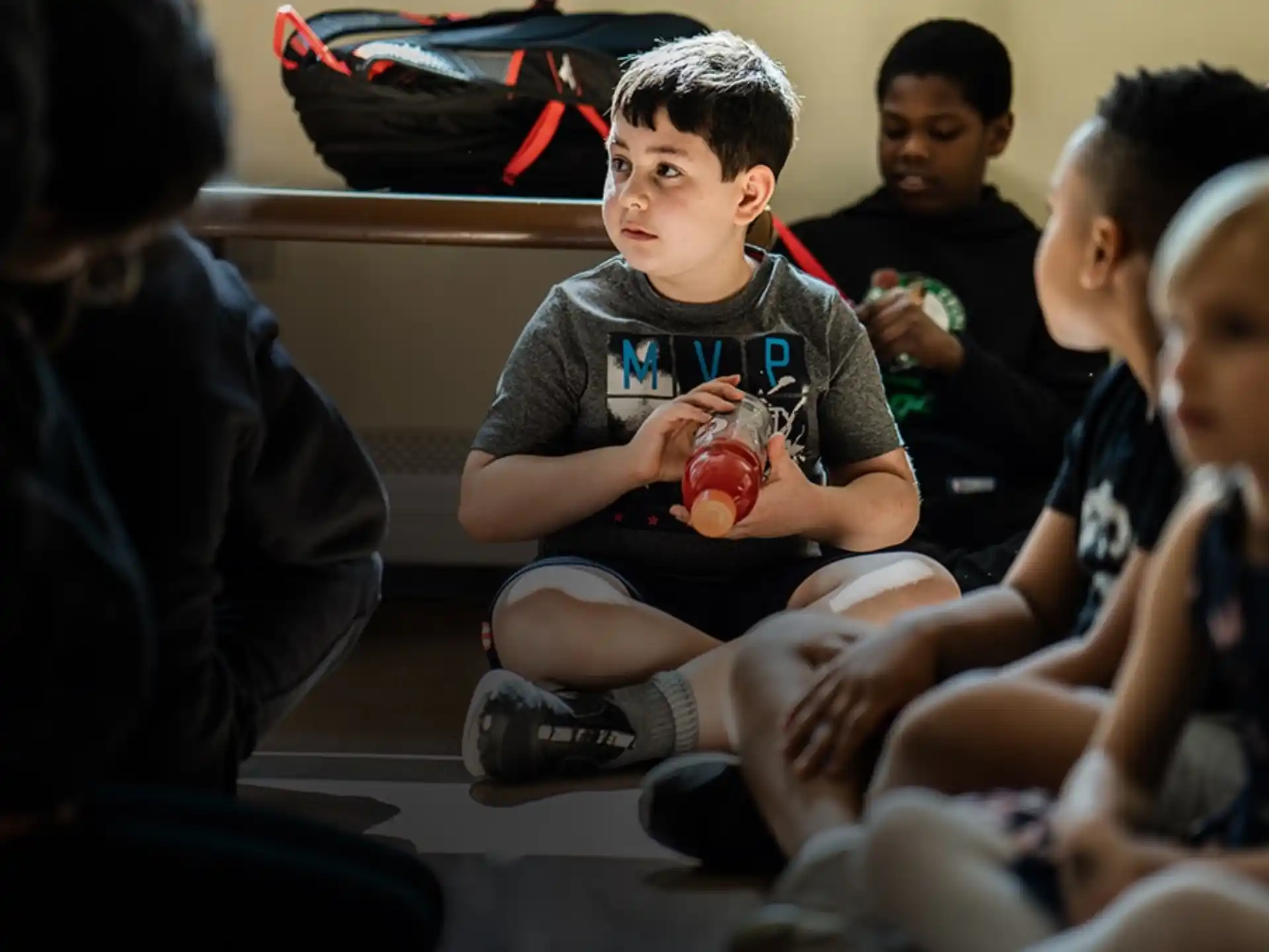 a group of children sitting on the floor