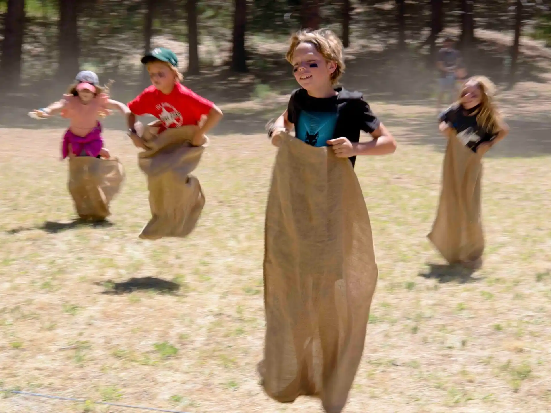 a group of people playing in a sandbox