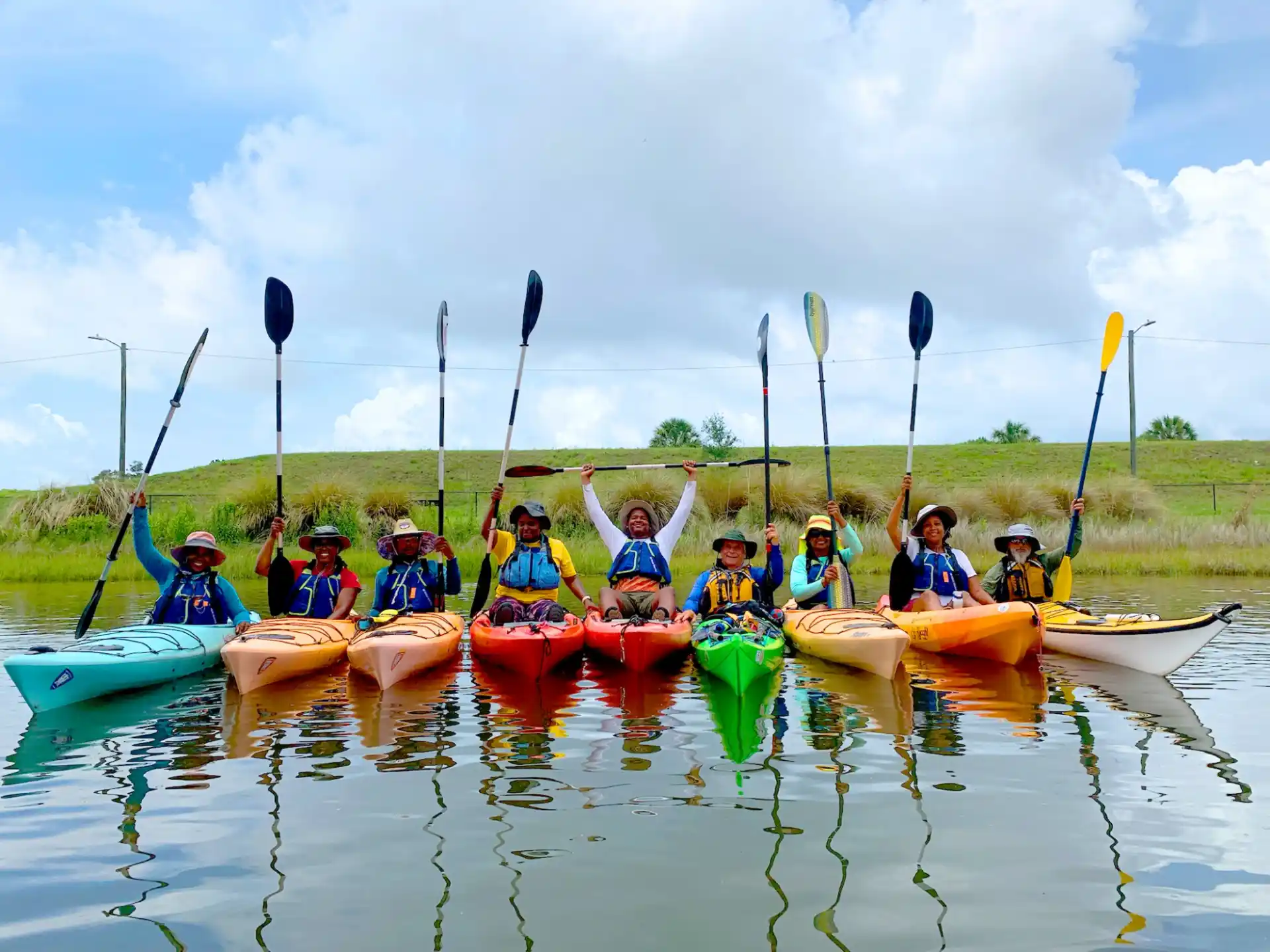 a group of people in canoes