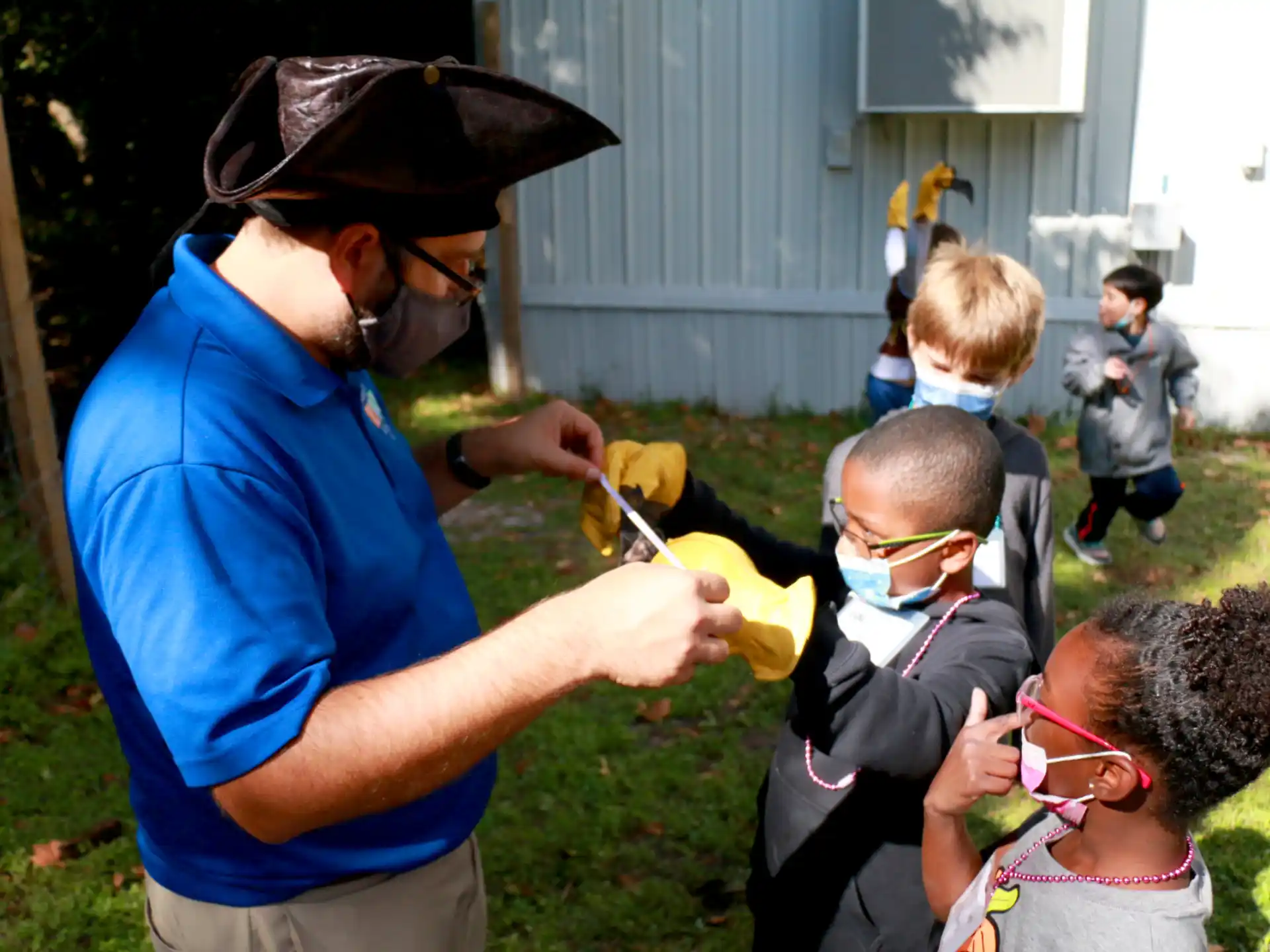 a person helping a kid with a toy