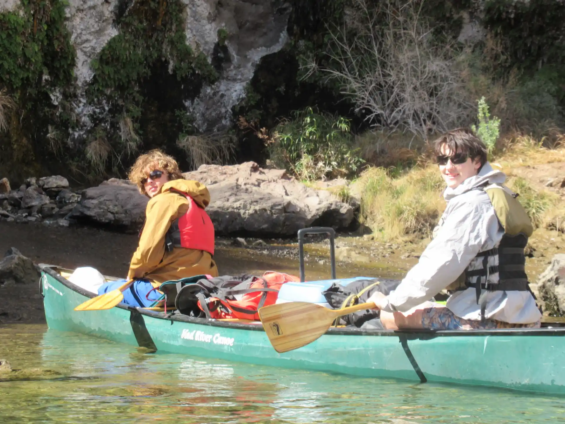 a group of people in a canoe