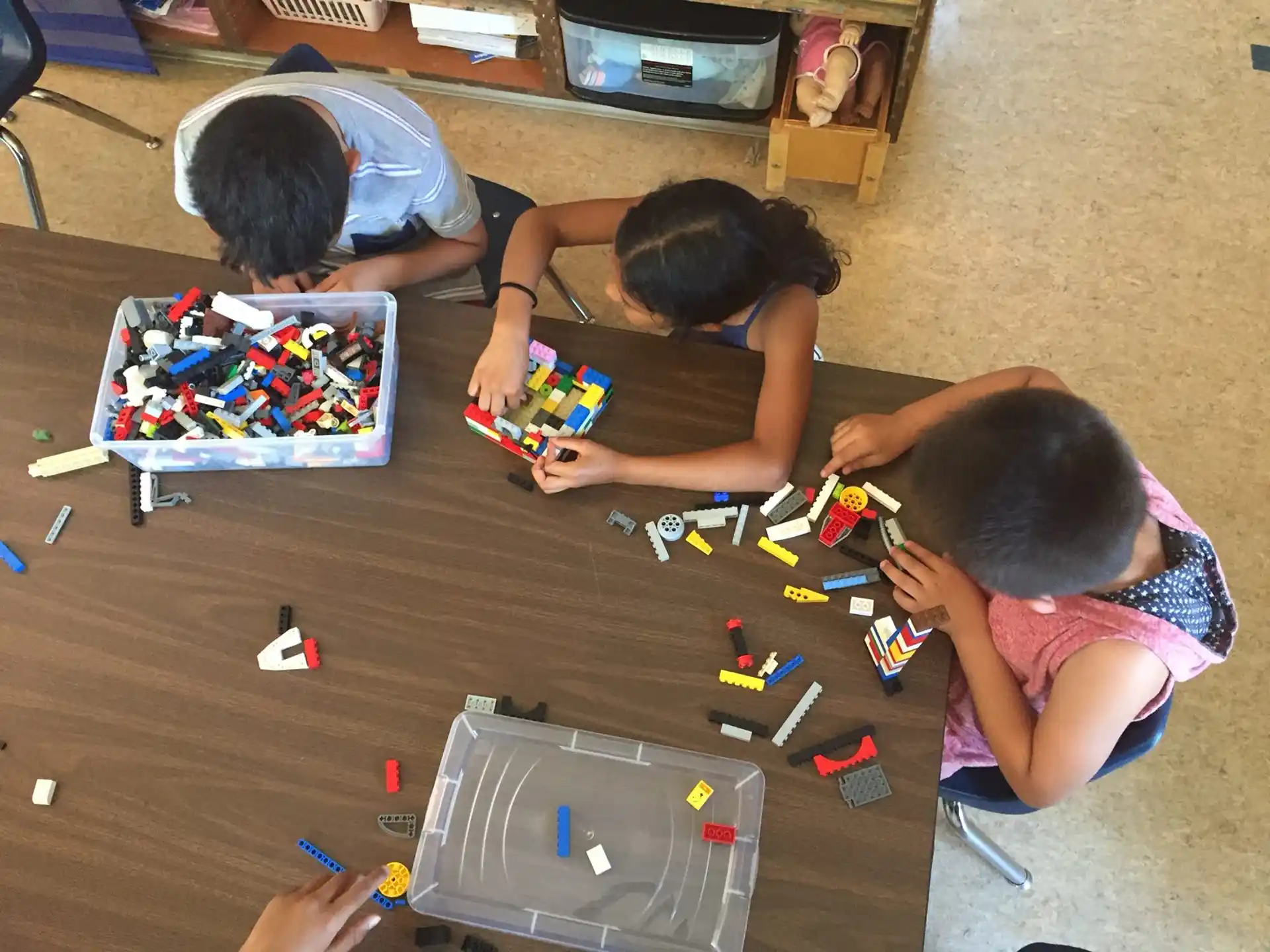 a group of children playing with toys