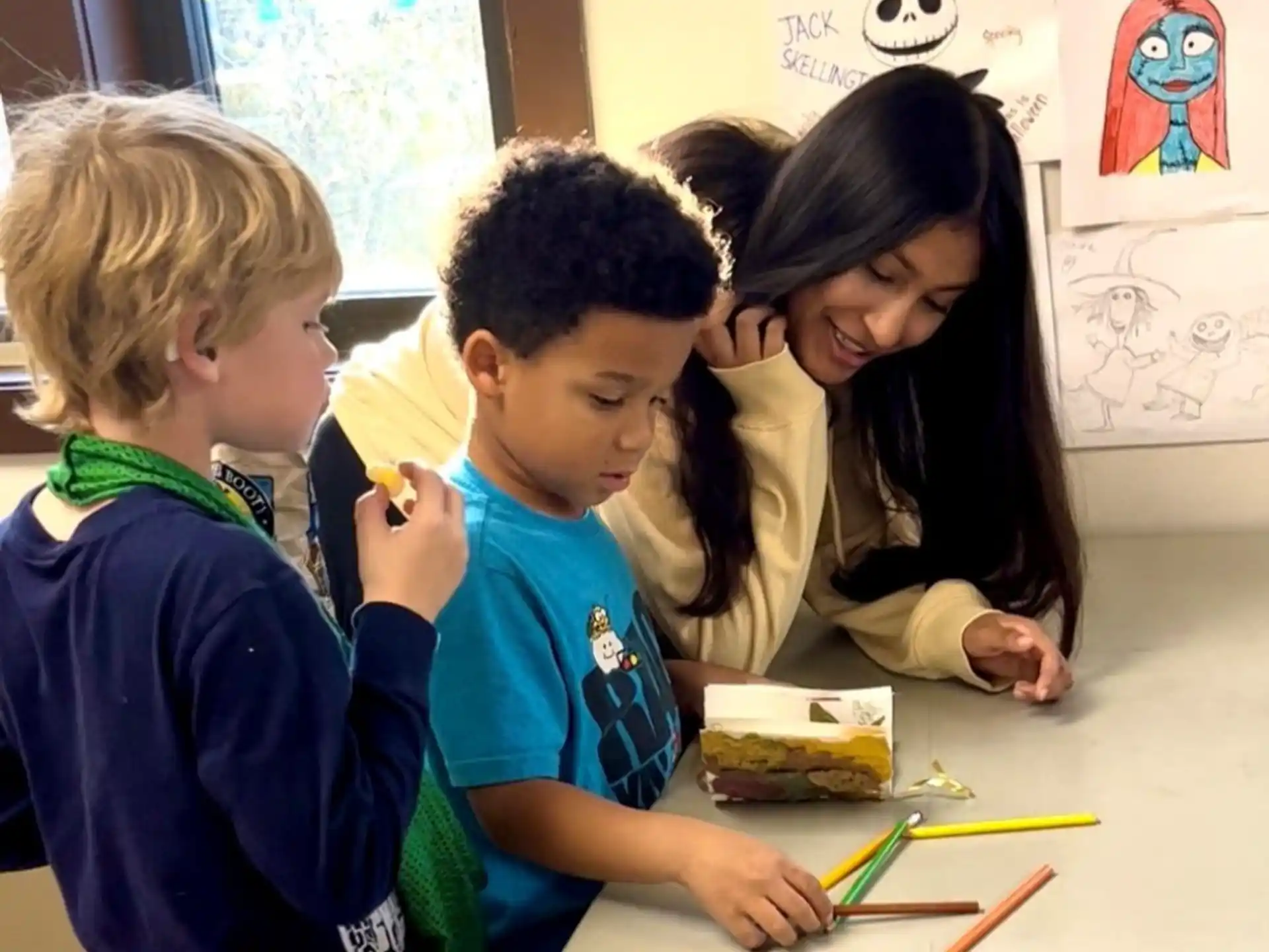 a group of children sitting at a table