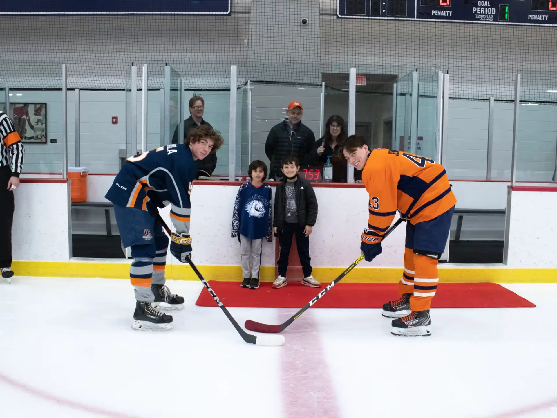 a group of people playing hockey