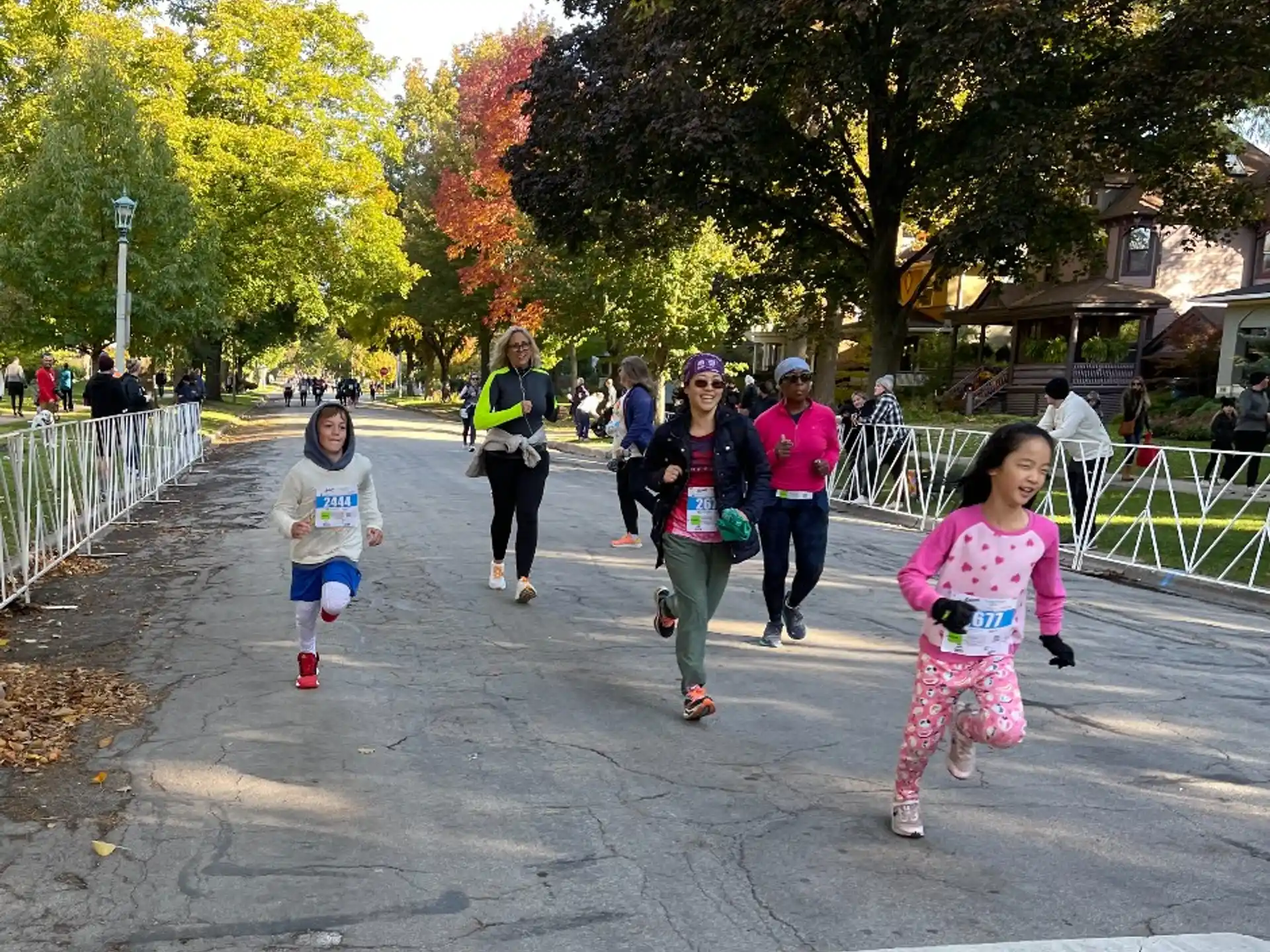 a group of people running on a street