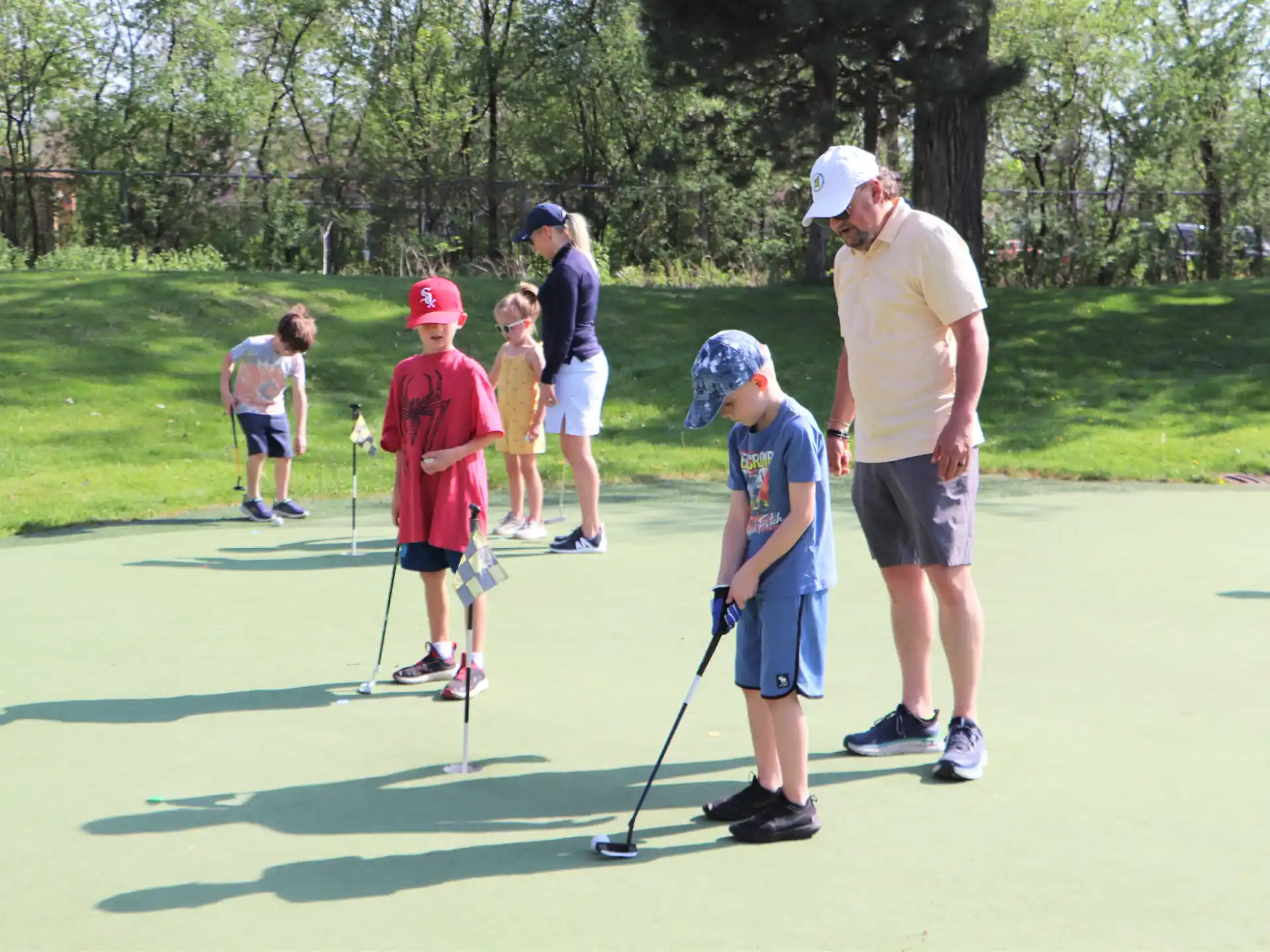 a group of people playing golf