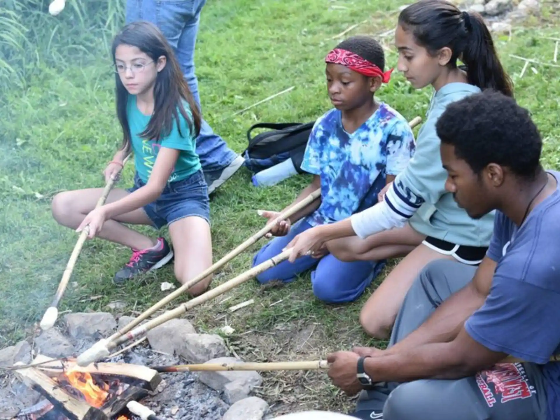 a group of people around a campfire