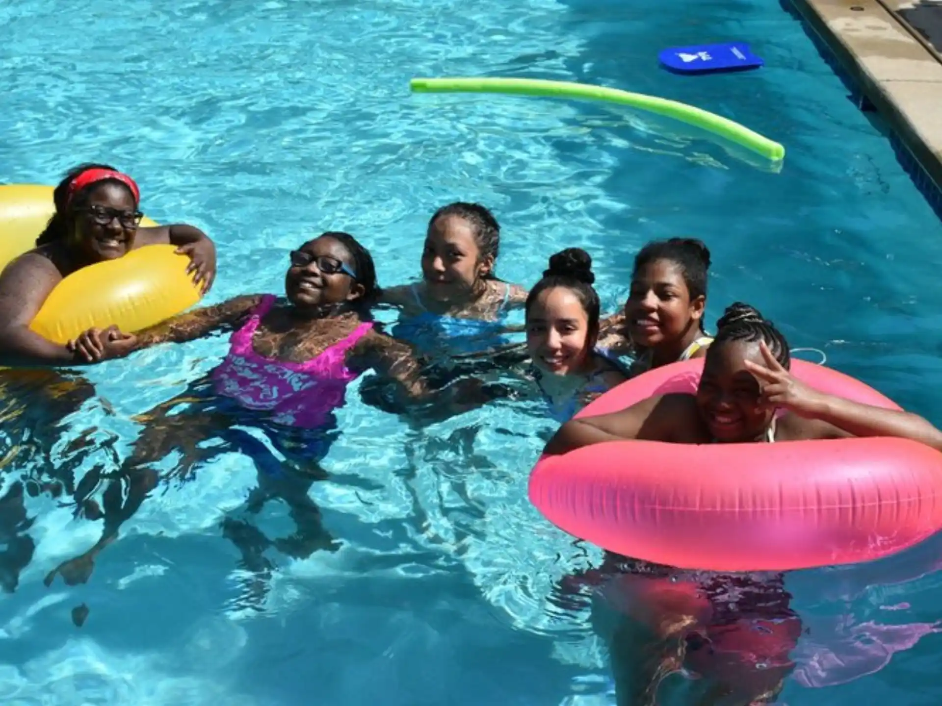 a group of people in a pool