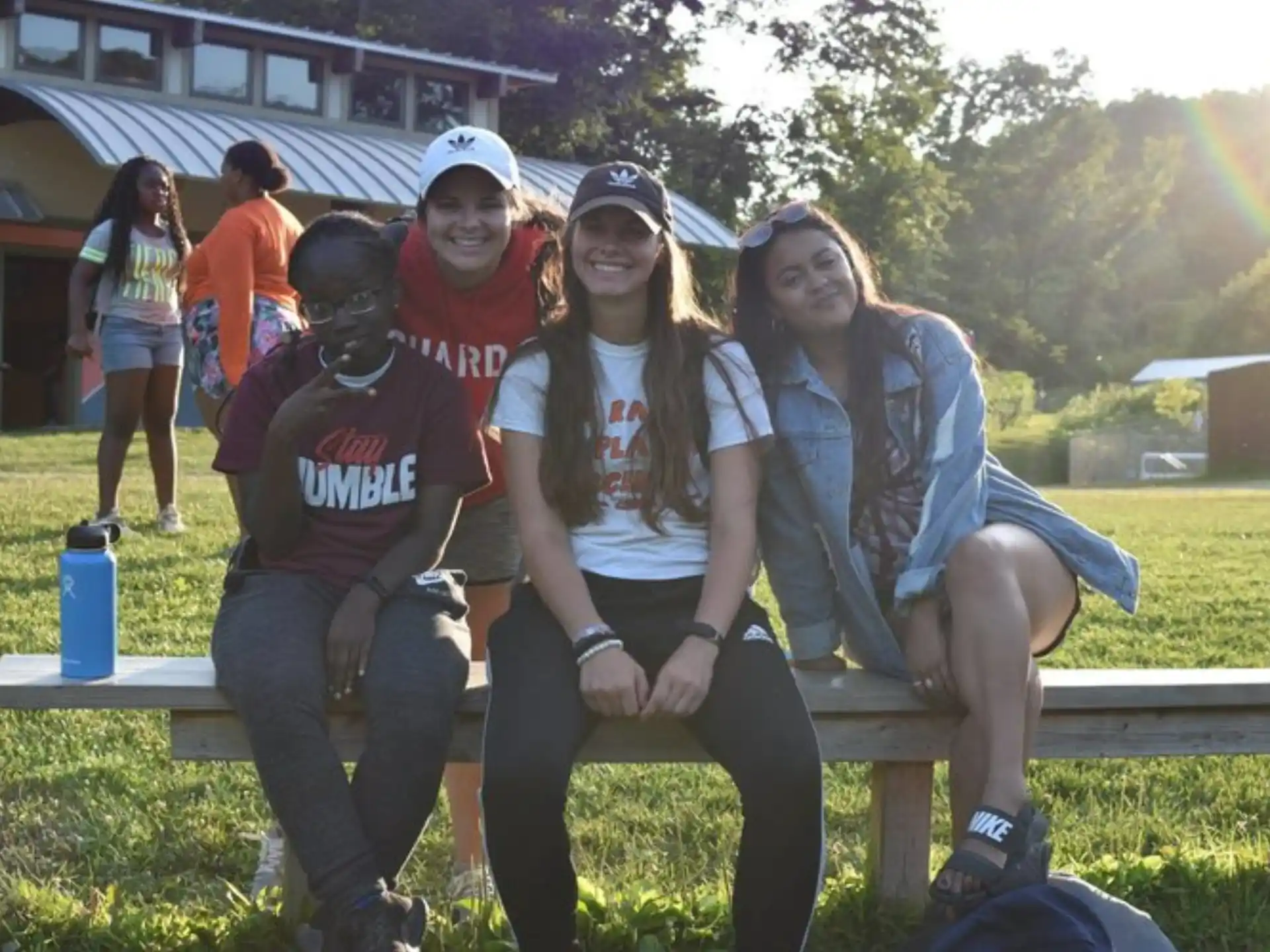 a group of people sitting on a bench