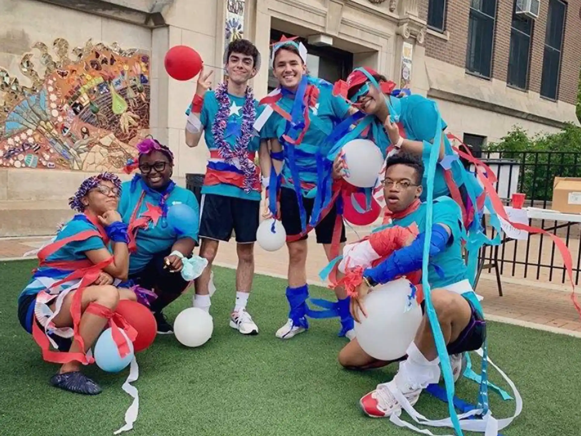 a group of people in clothing posing for a photo