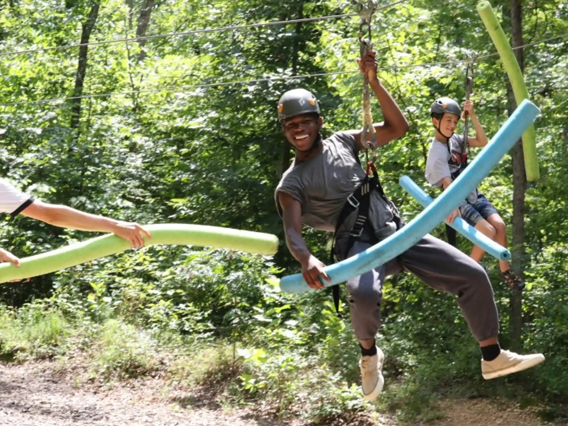 a group of people holding onto a rope