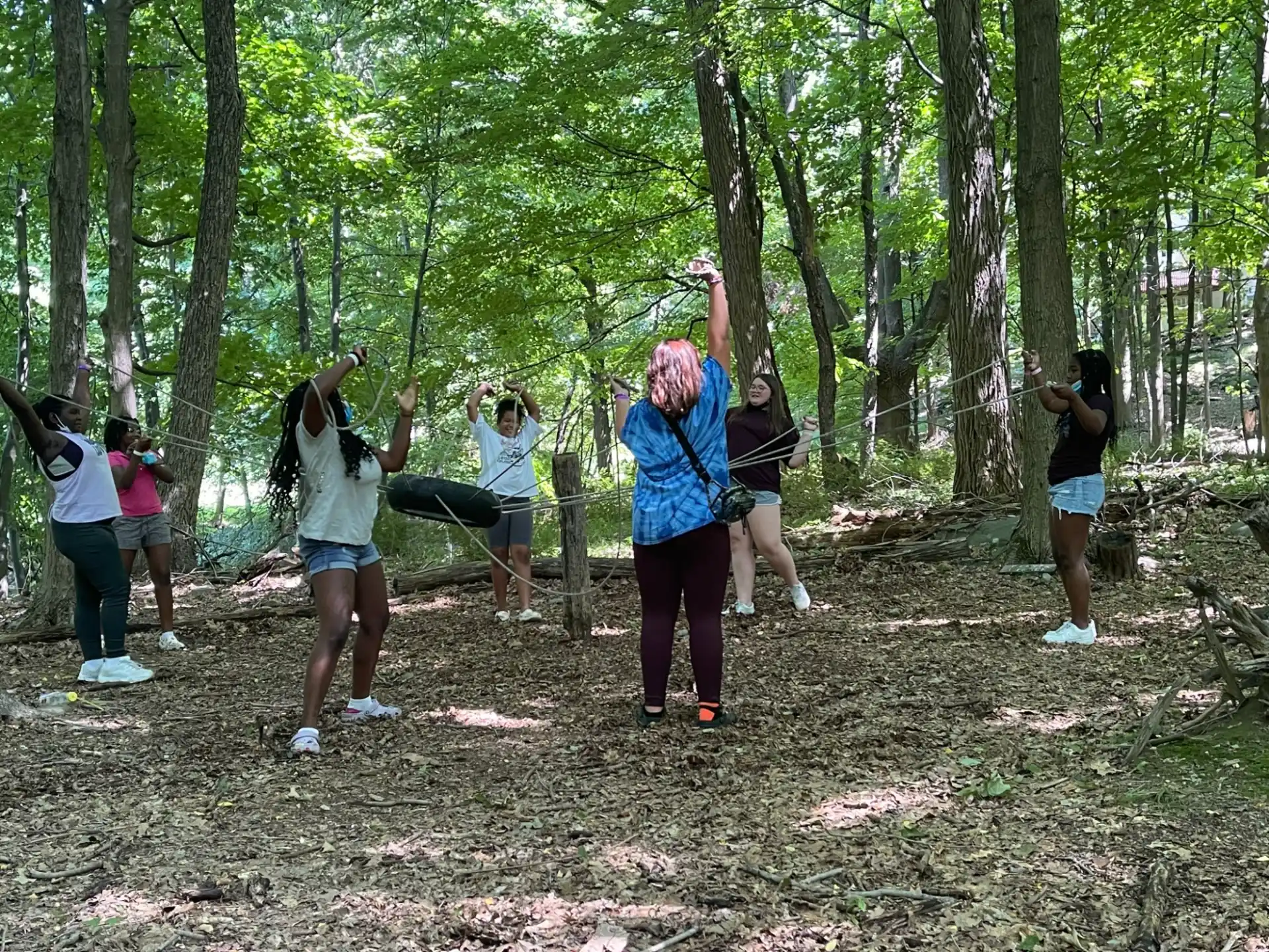 a group of people in a forest