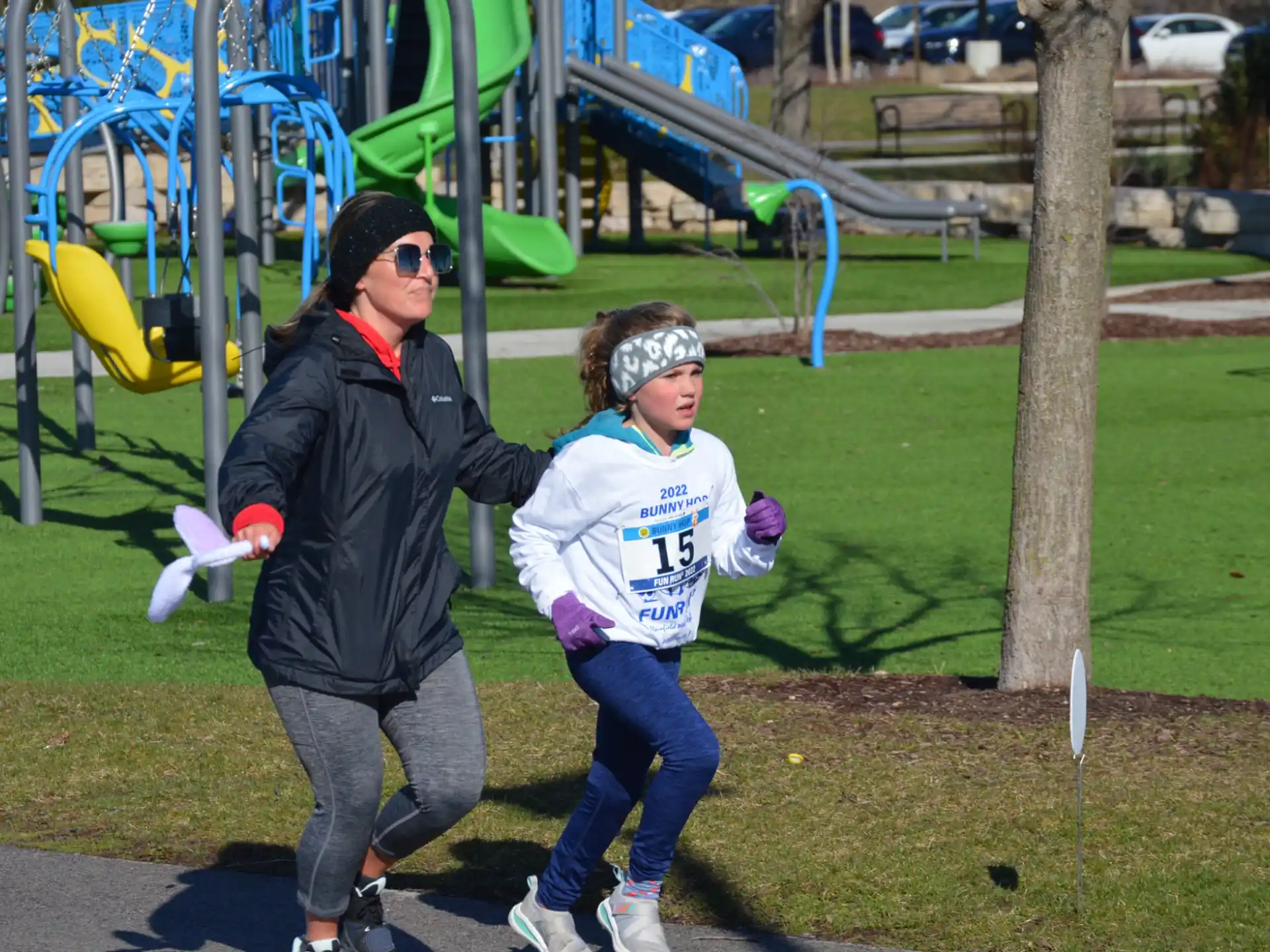 a person and a girl playing in a playground