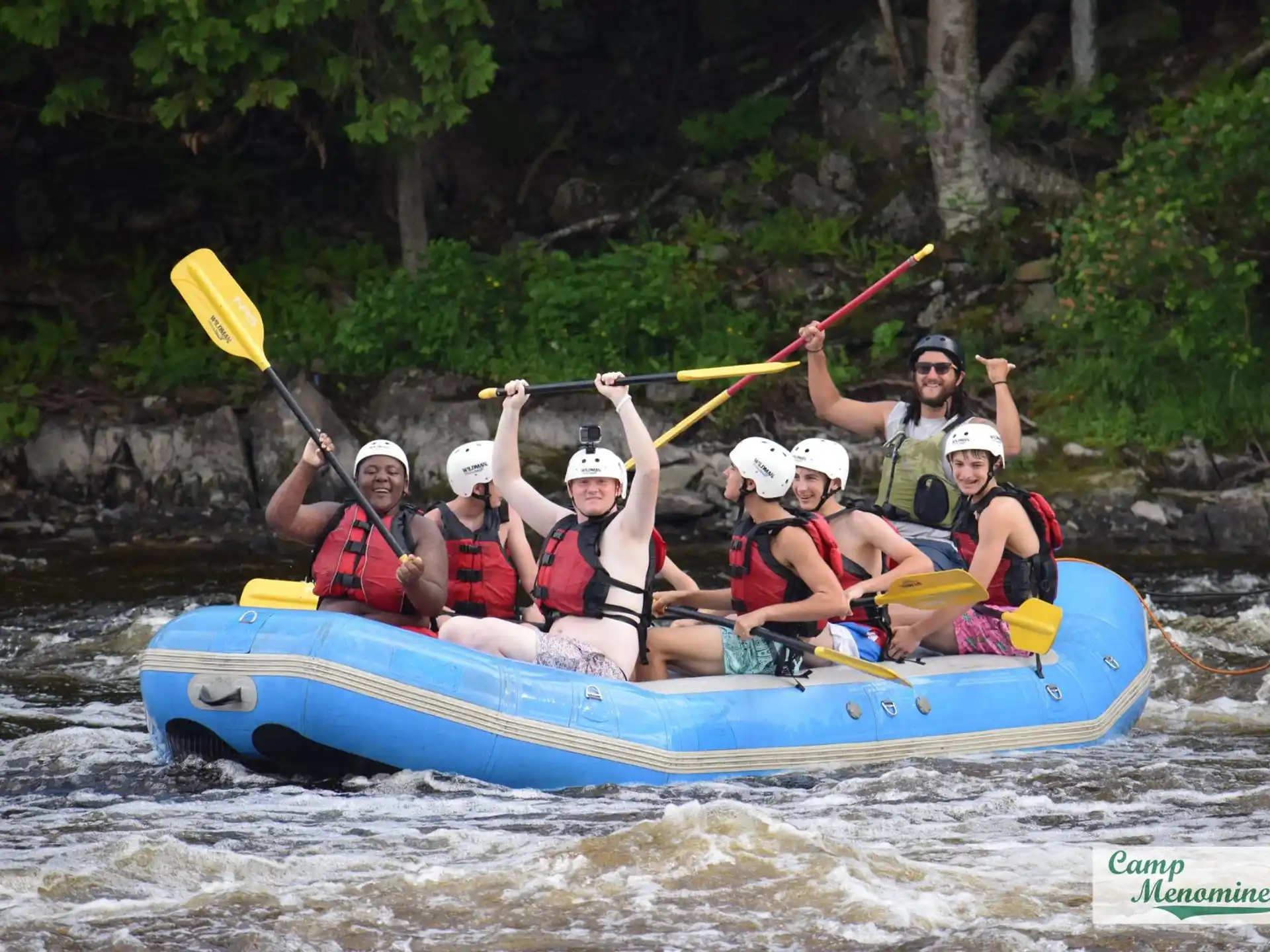 a group of people in a raft