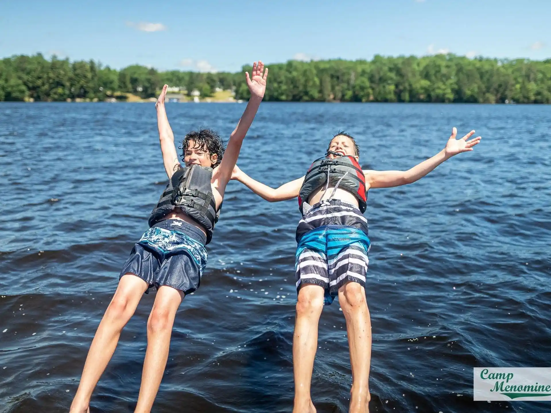 two people standing in water