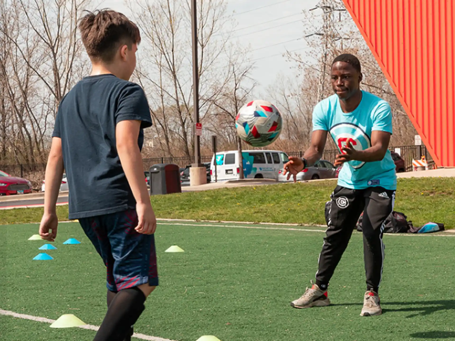 a couple of men playing football