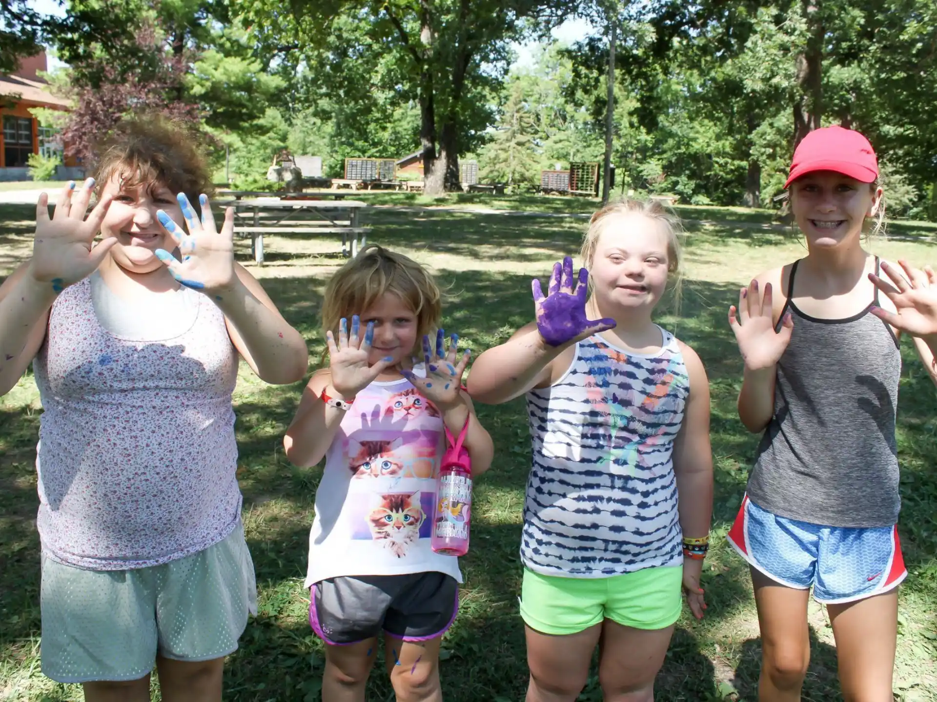 a group of children holding up their hands
