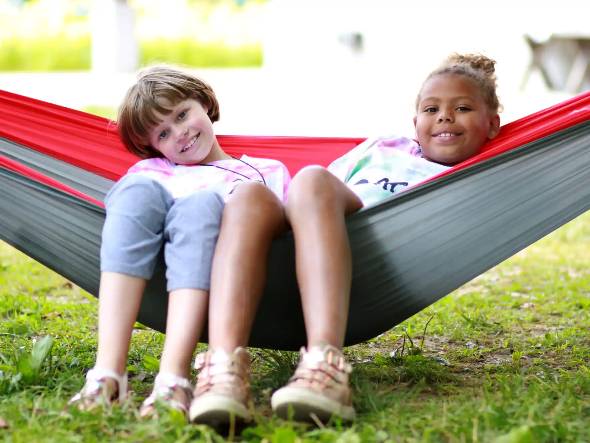 two children sitting on a bench