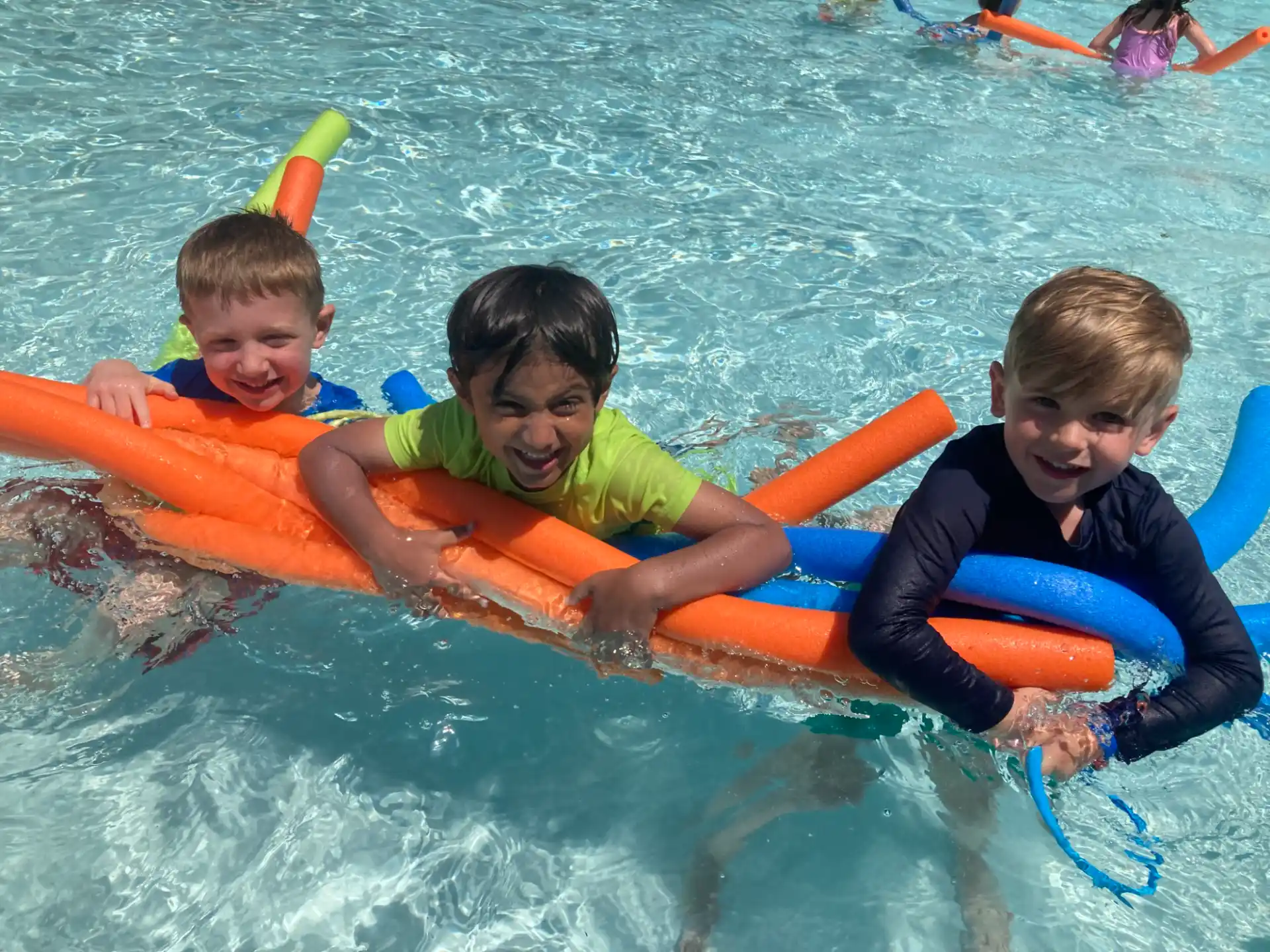 a group of kids in a pool