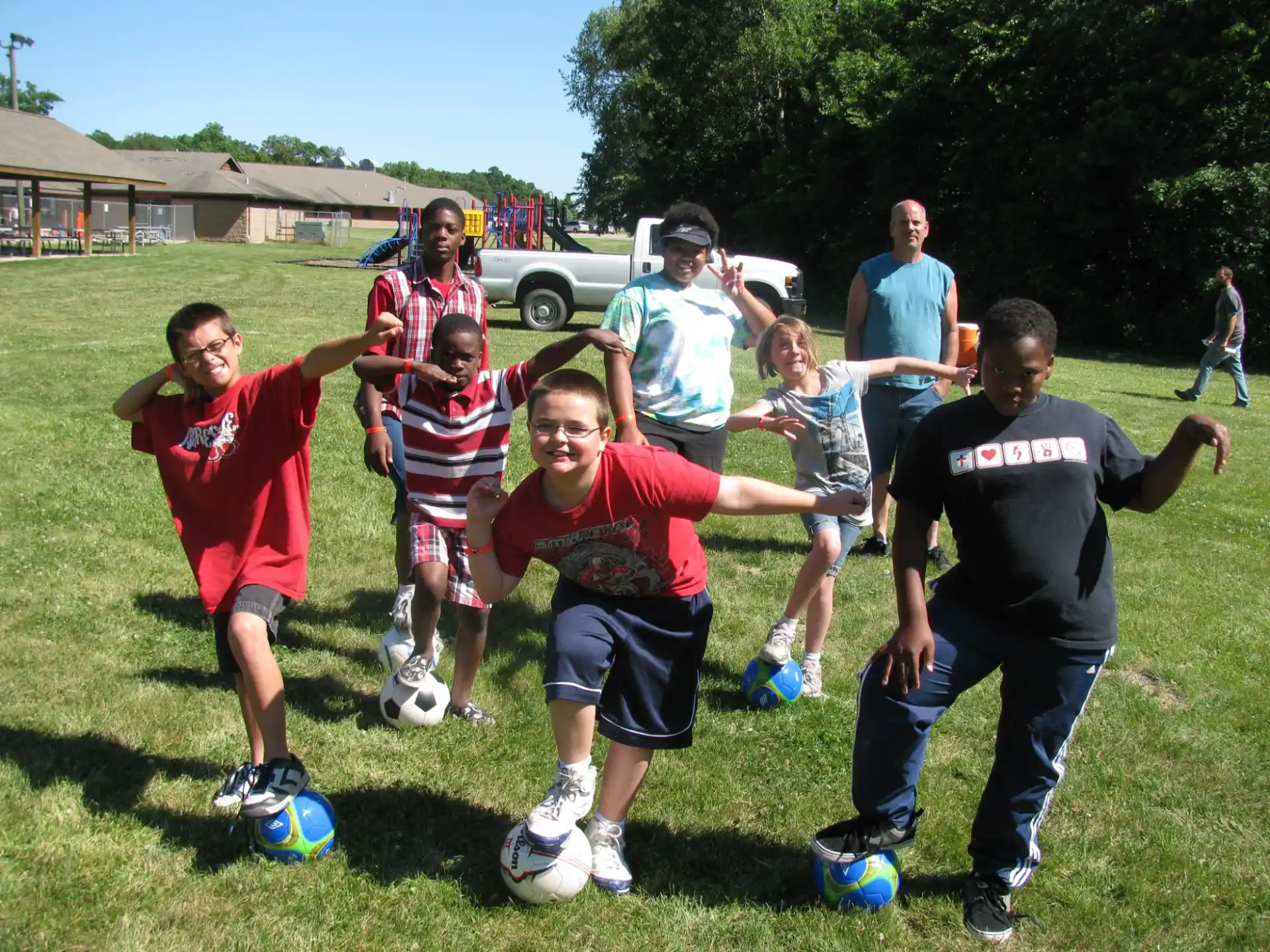 a group of kids playing football