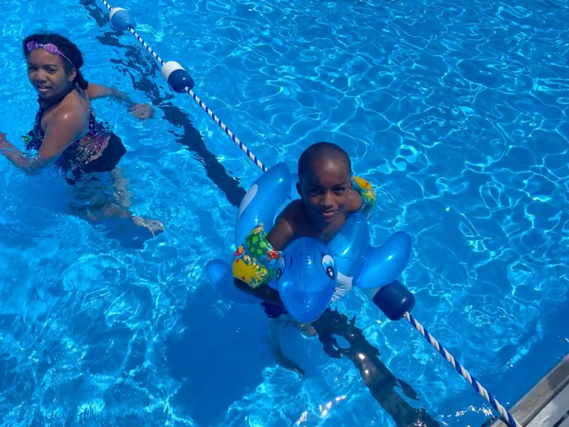 a man and woman in a pool