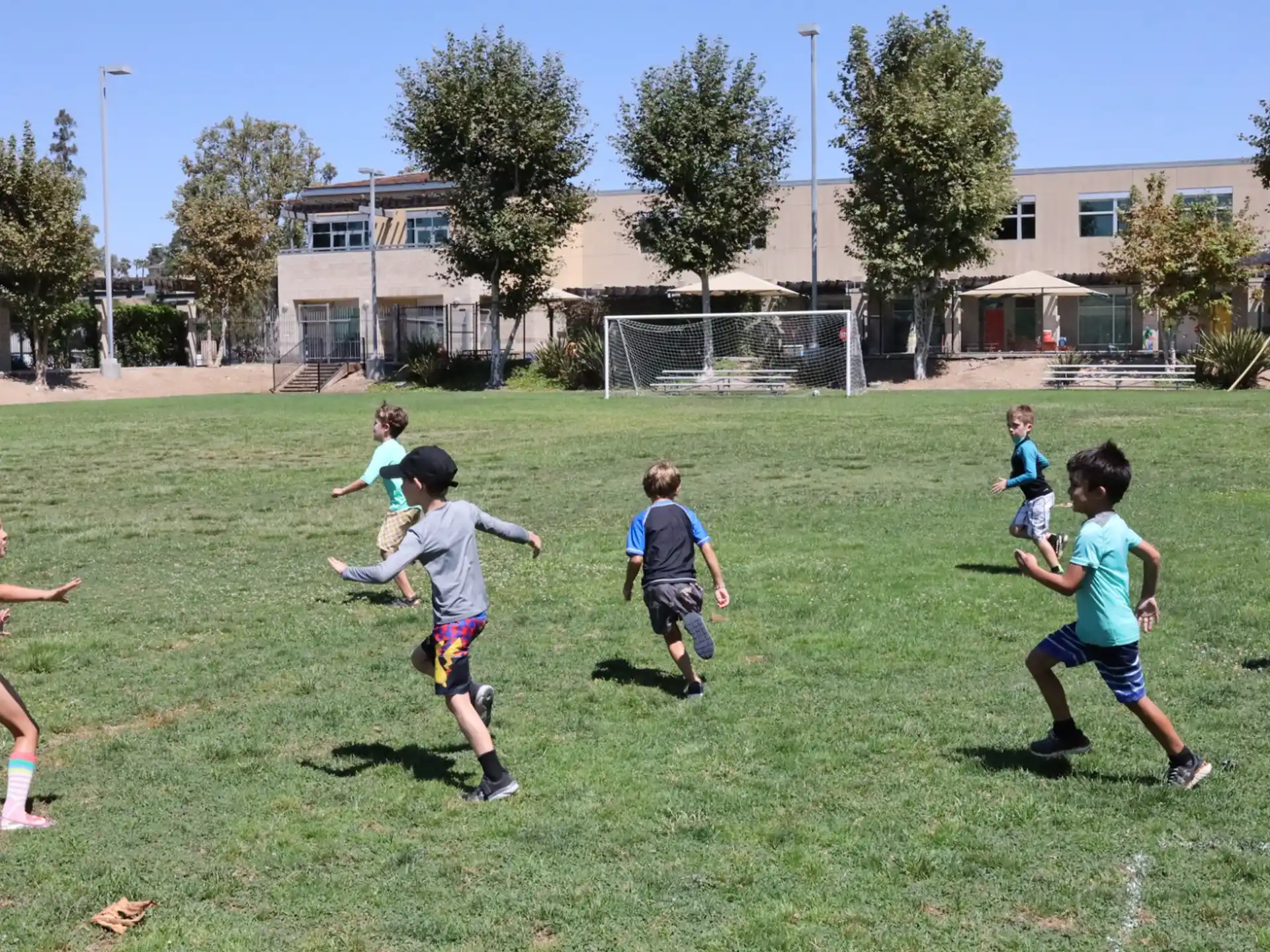 a group of kids playing in a field
