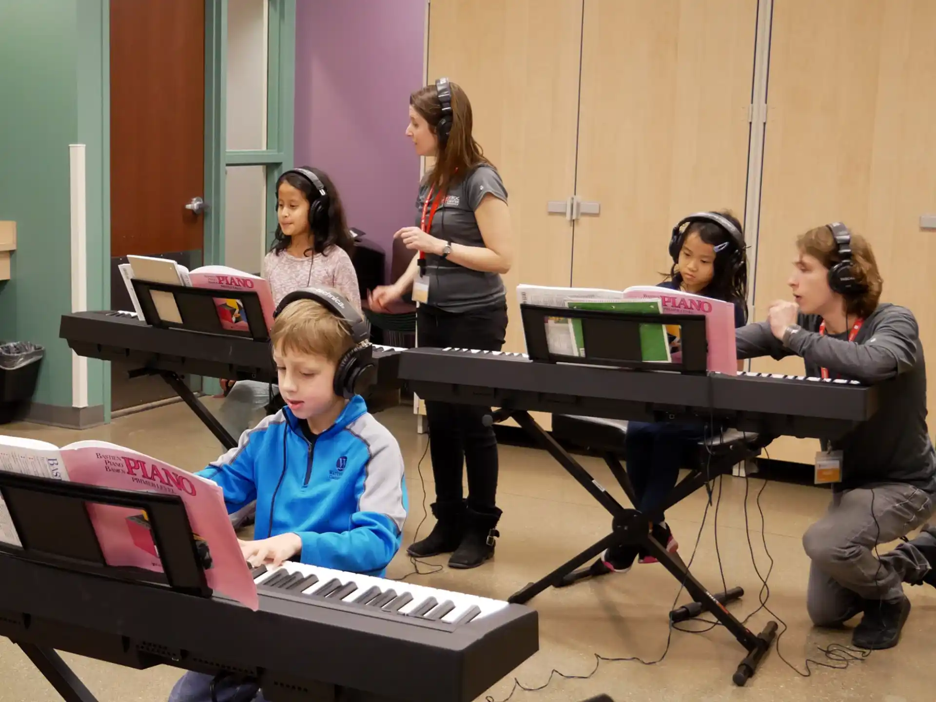 a group of people sitting at a table with musical instruments