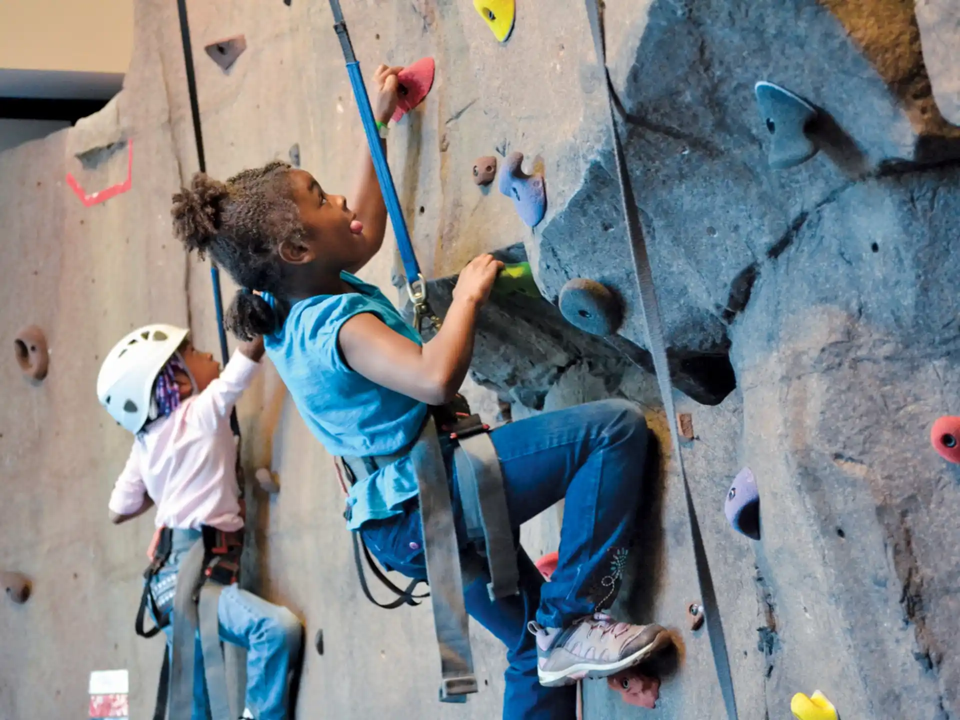 a person climbing a rock wall