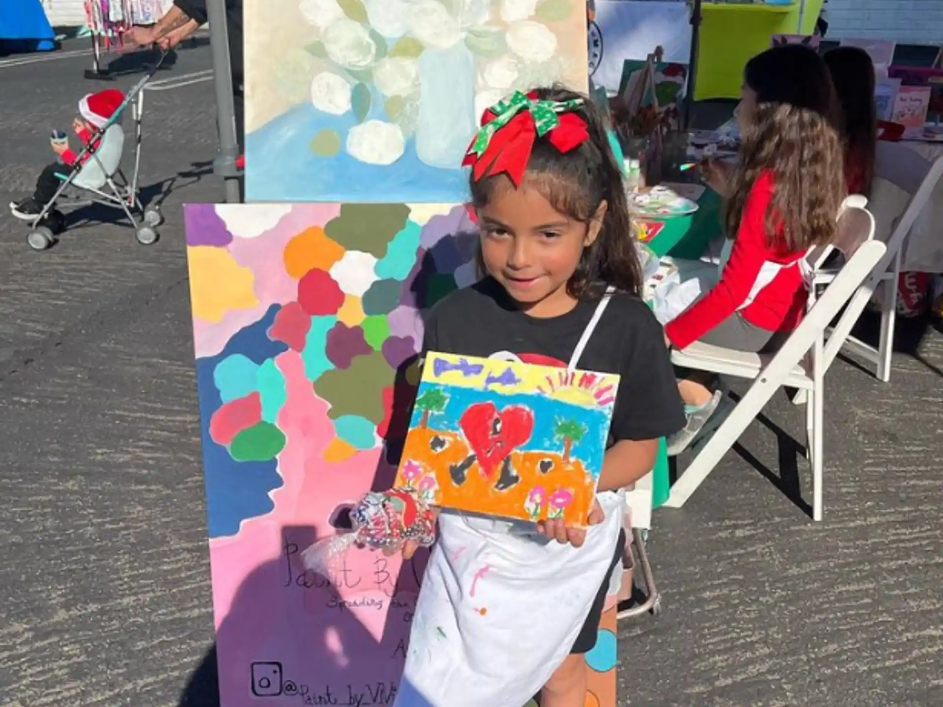 a girl holding a kite